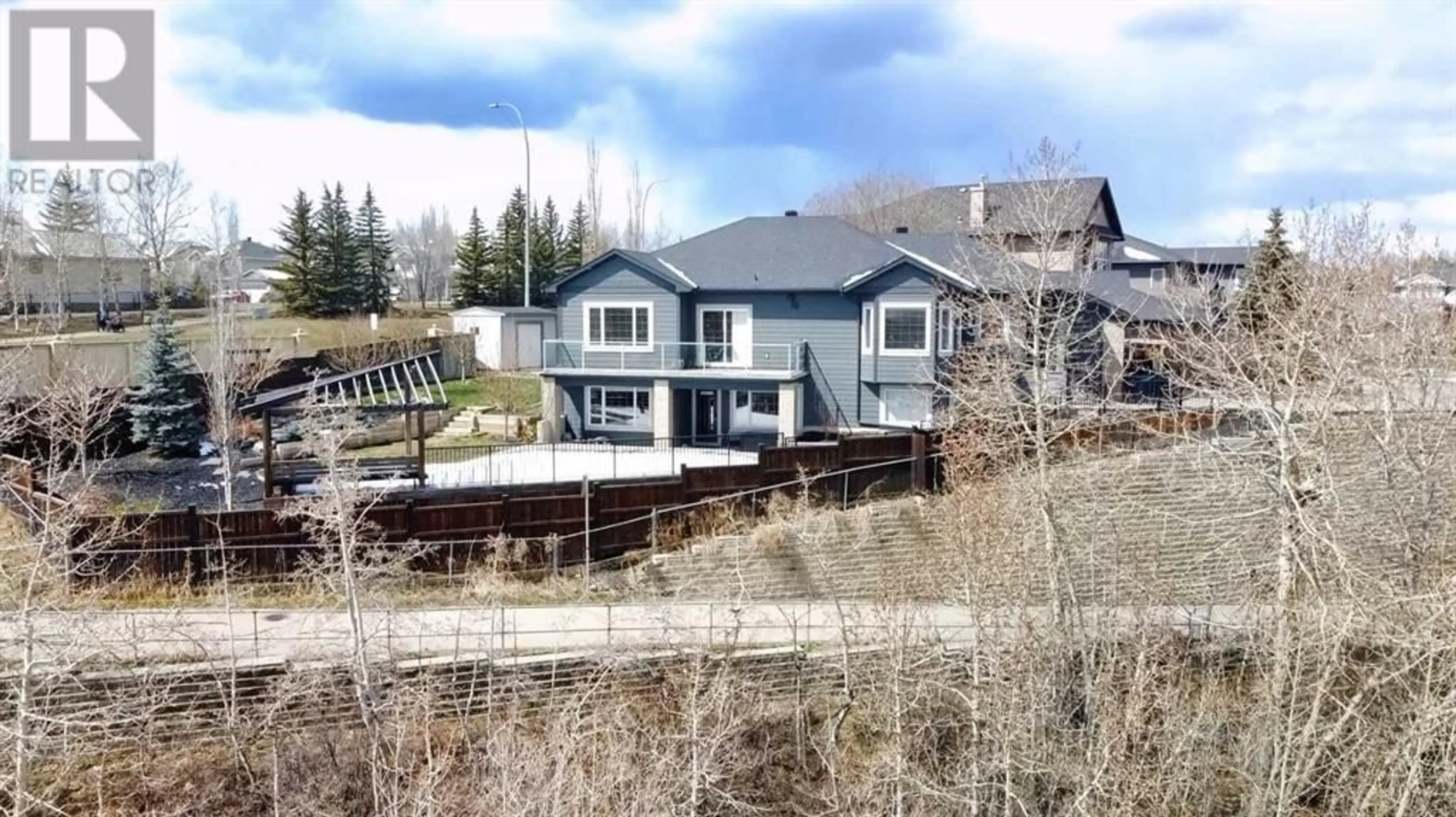 Frontside or backside of a home for 24 Royal Highland Court NW, Calgary Alberta T3G4Y2