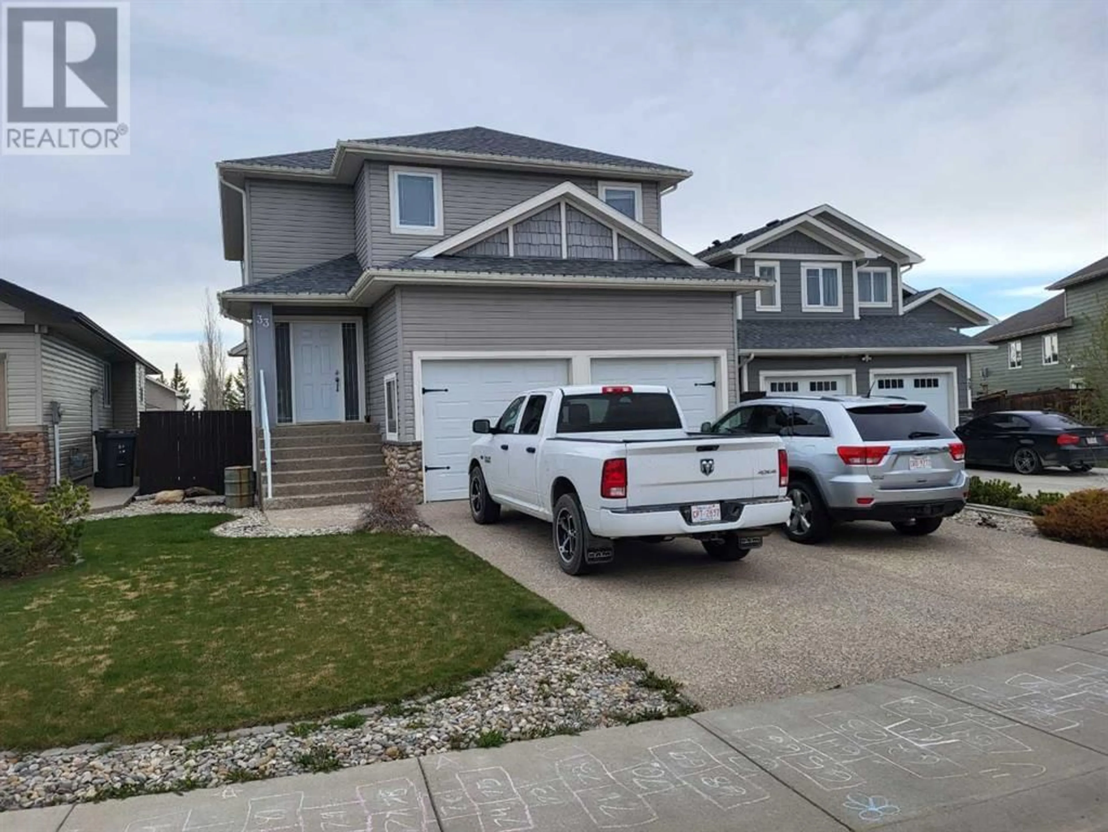 Frontside or backside of a home for 33 Laurel Place, Coalhurst Alberta T0L0V0
