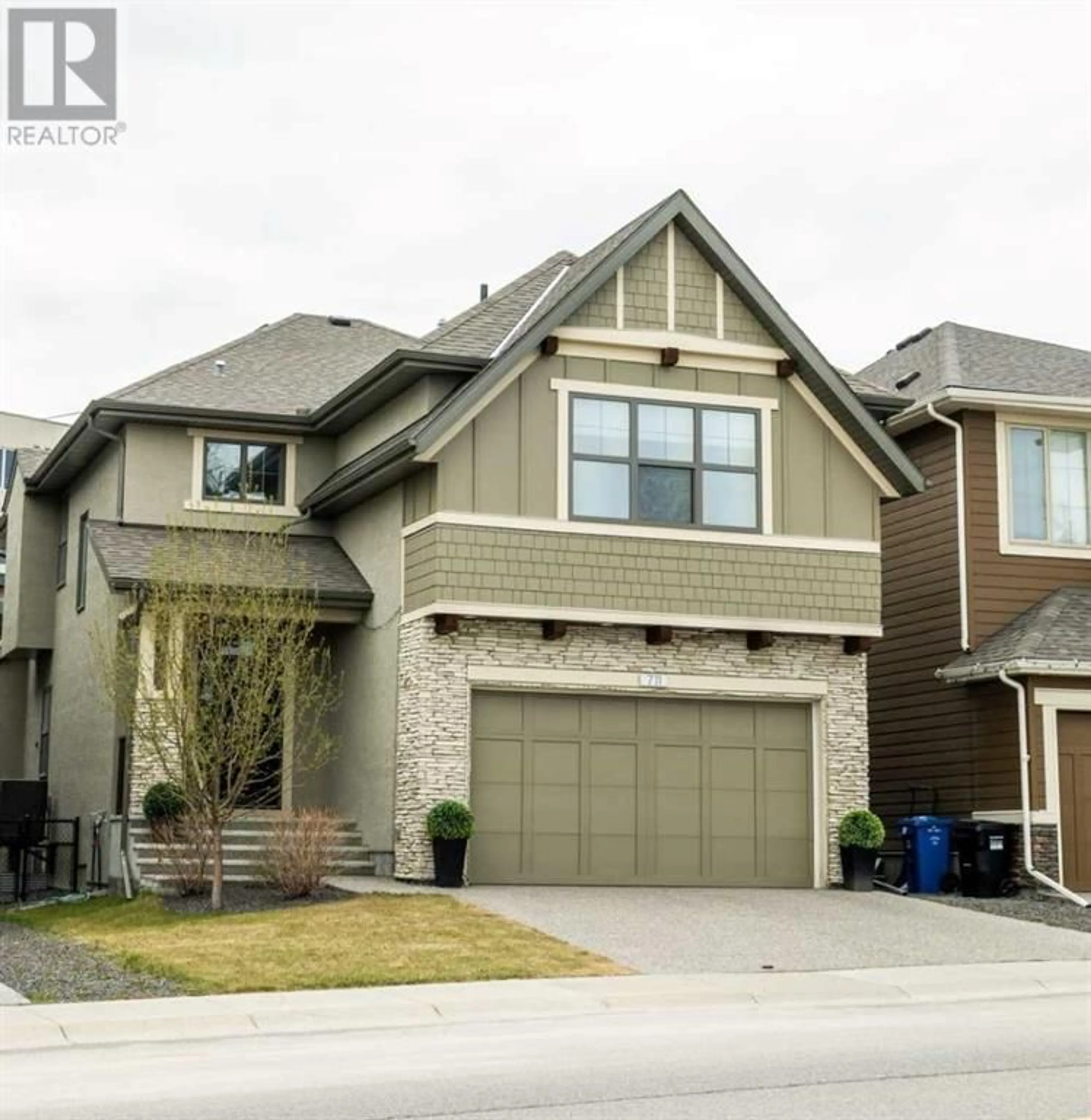 Frontside or backside of a home for 711 Shawnee Drive SW, Calgary Alberta T2Y1V6