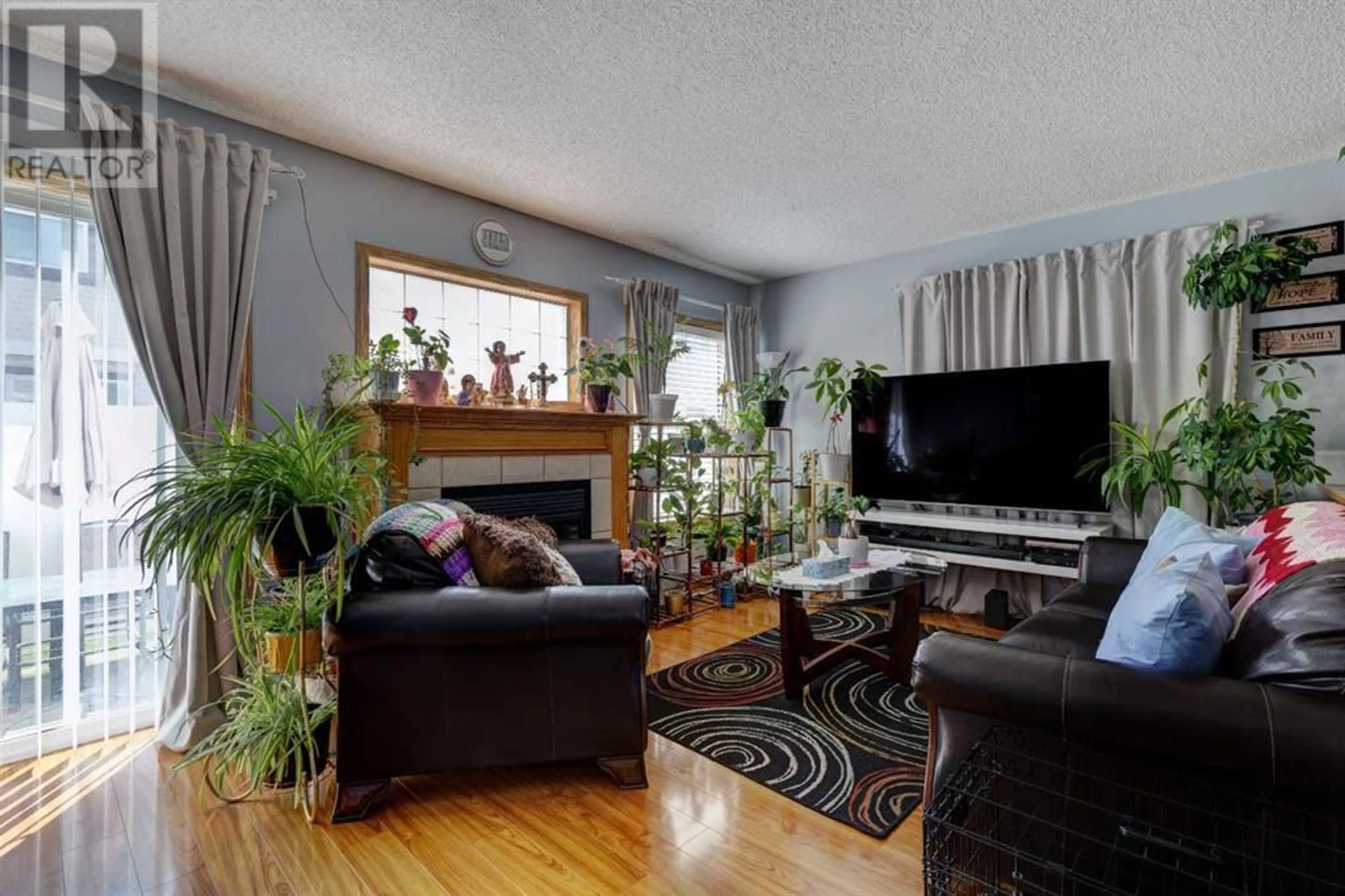 Living room for 211 Millview Green SW, Calgary Alberta T2Y3W1