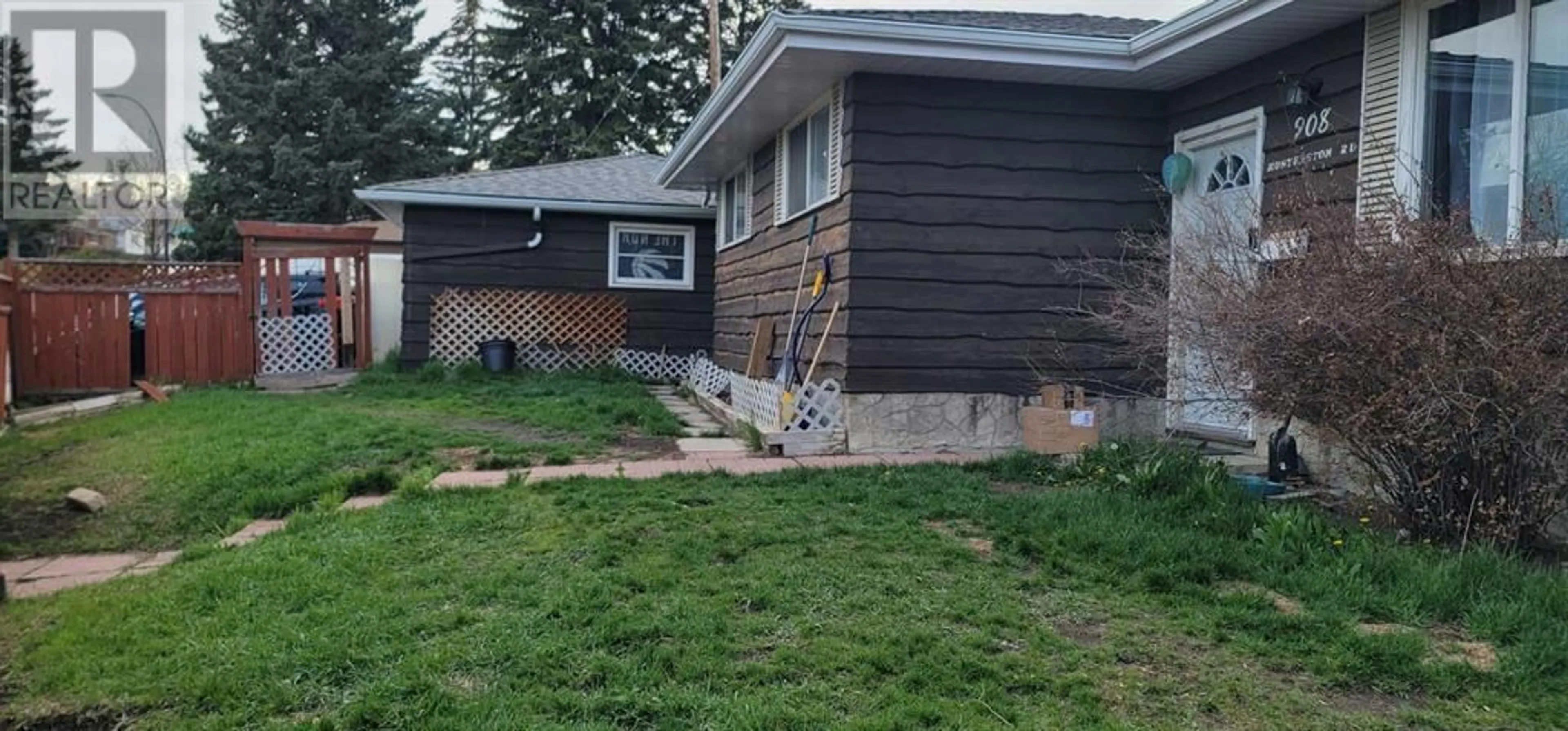 Frontside or backside of a home for 908 Hunterston Road NW, Calgary Alberta T2K4M7