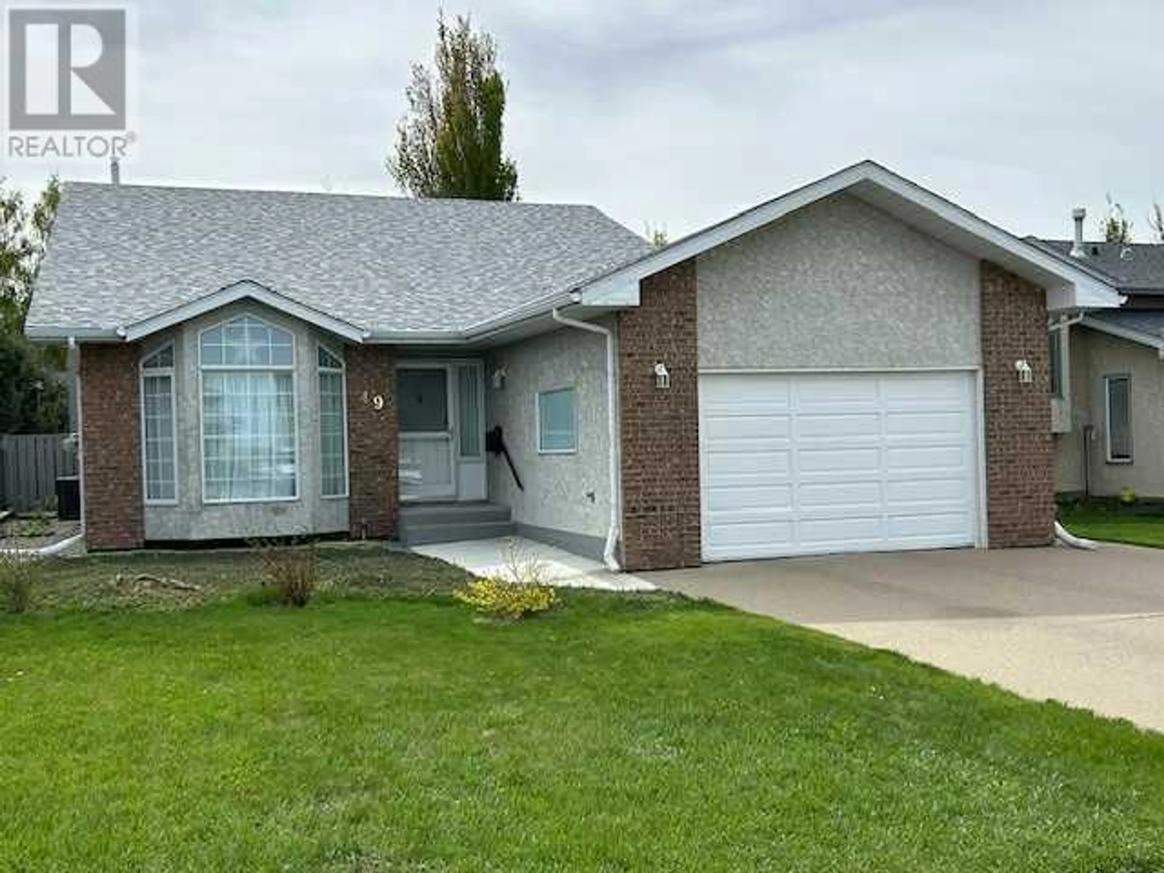 Frontside or backside of a home for 49 Stafford Road N, Lethbridge Alberta T1H6C9