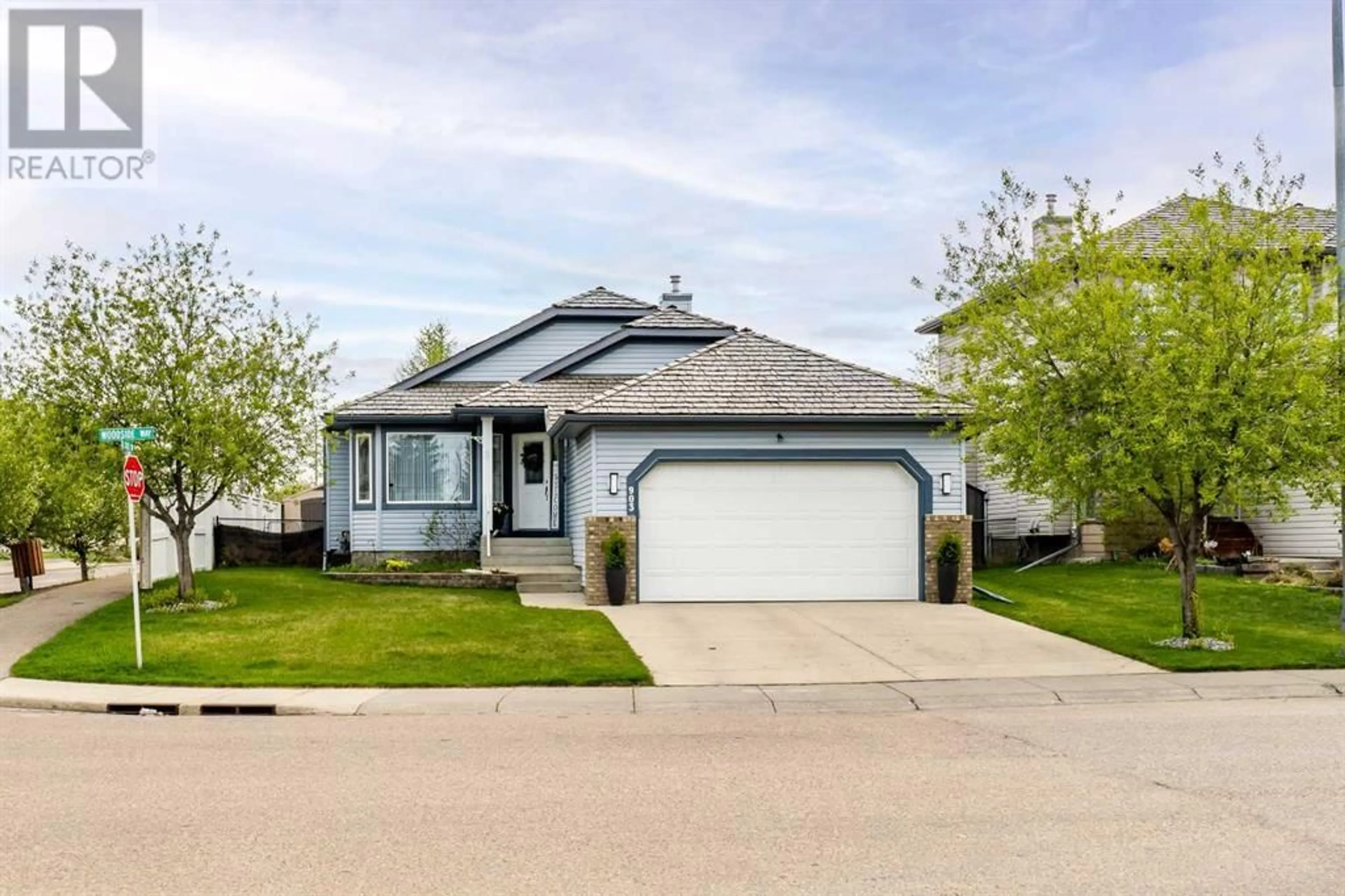 Frontside or backside of a home for 903 Woodside Way NW, Airdrie Alberta T4B2S3