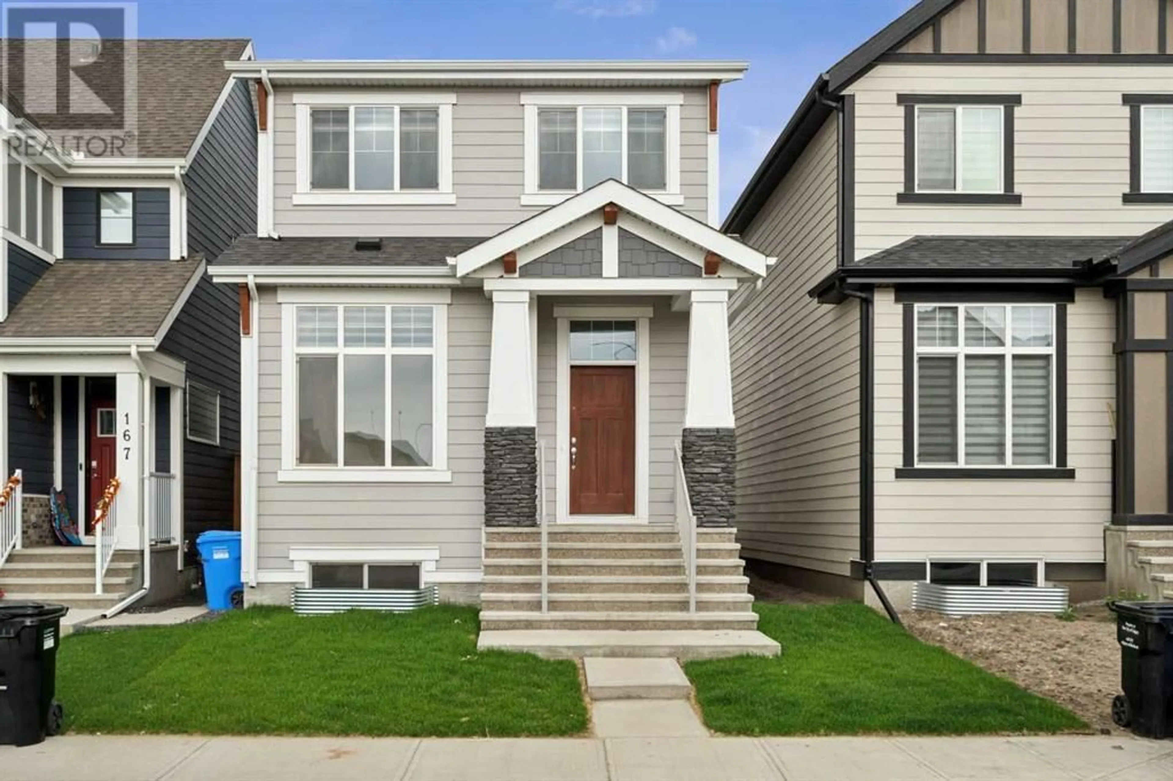 Frontside or backside of a home for 163 Magnolia Way SE, Calgary Alberta T3M2W3