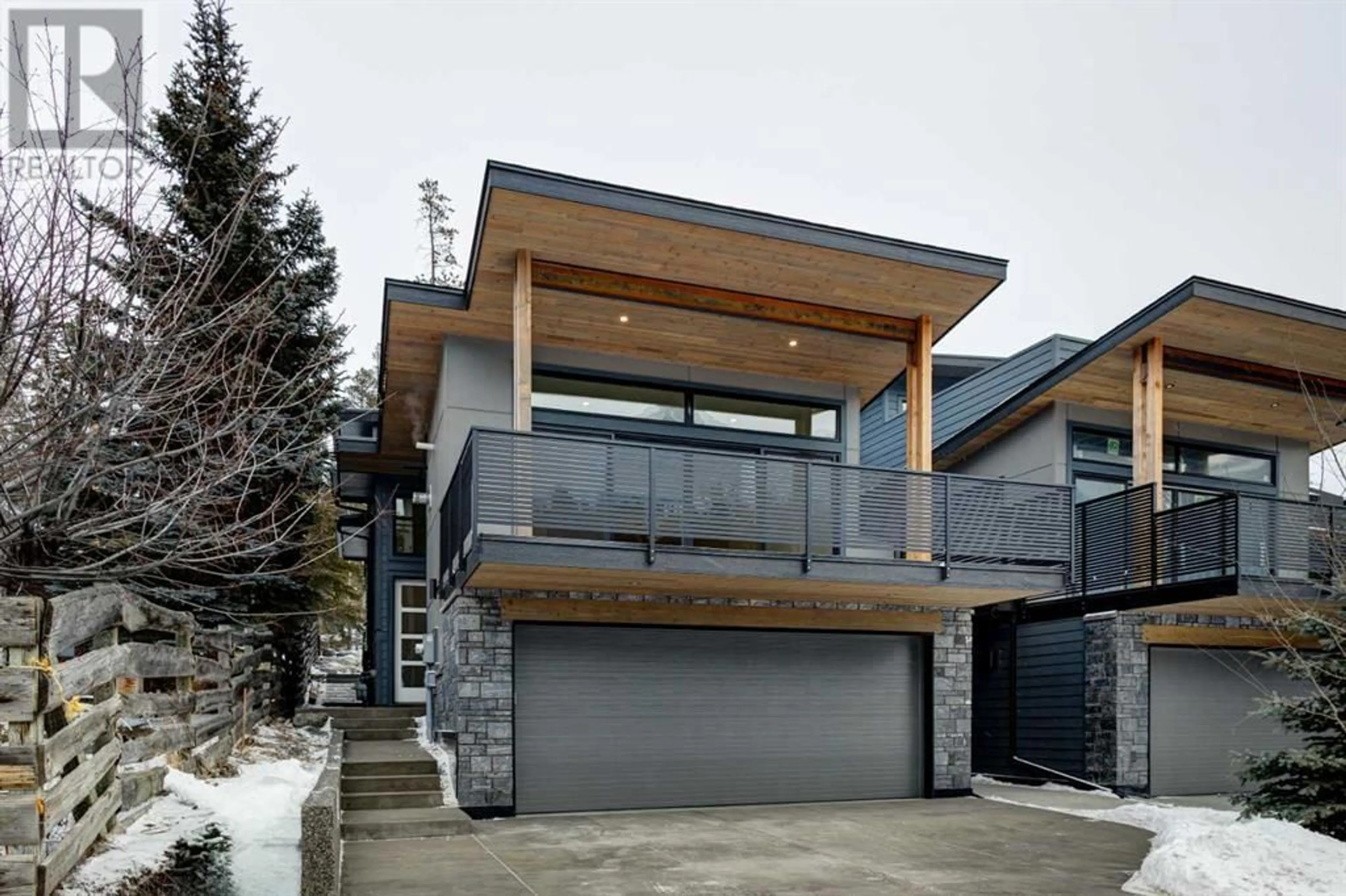 Frontside or backside of a home for 274 C&D Three Sisters Drive, Canmore Alberta T1W2M7