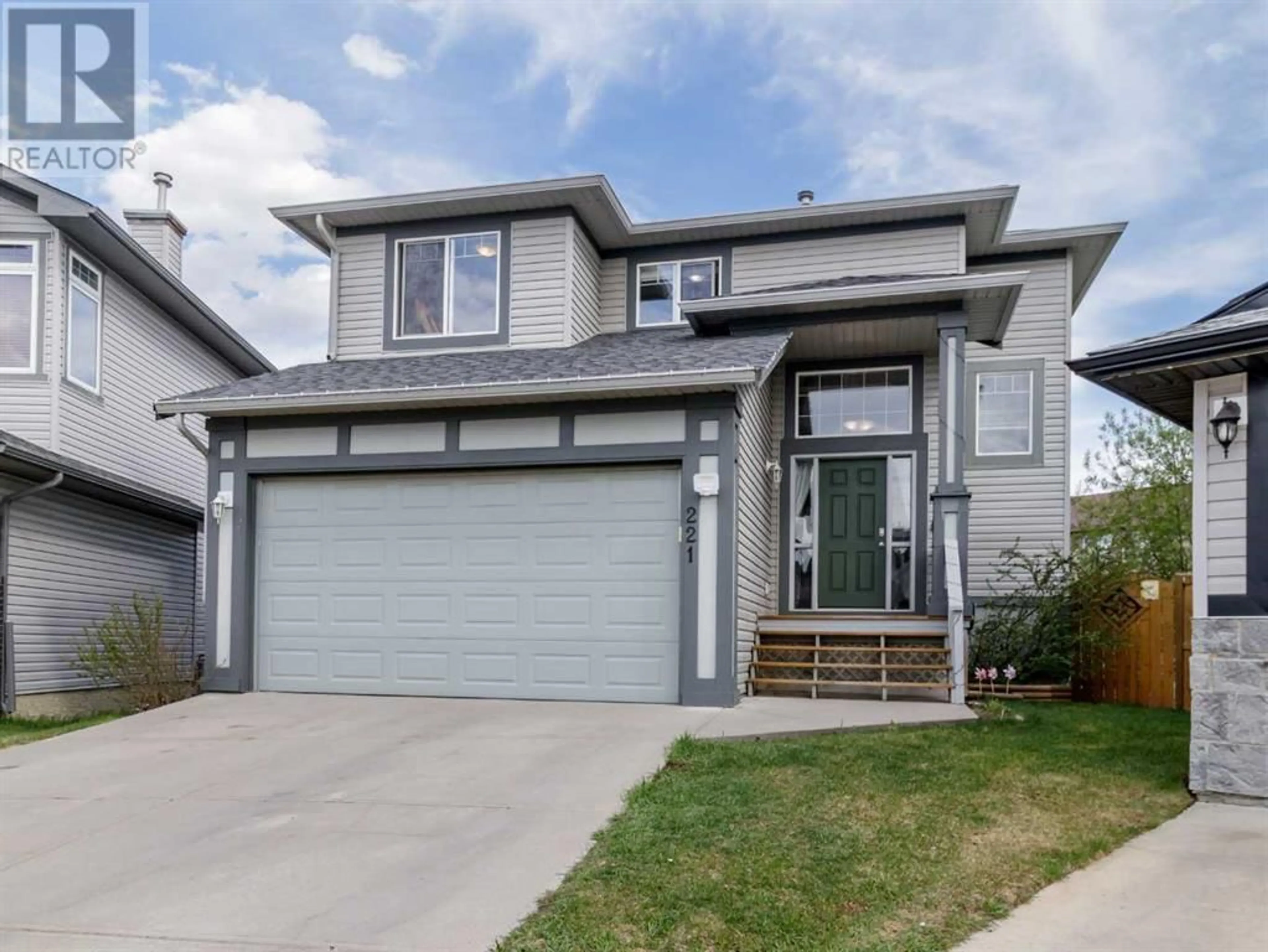 Frontside or backside of a home for 221 Luxstone Green SW, Airdrie Alberta T4B3B5