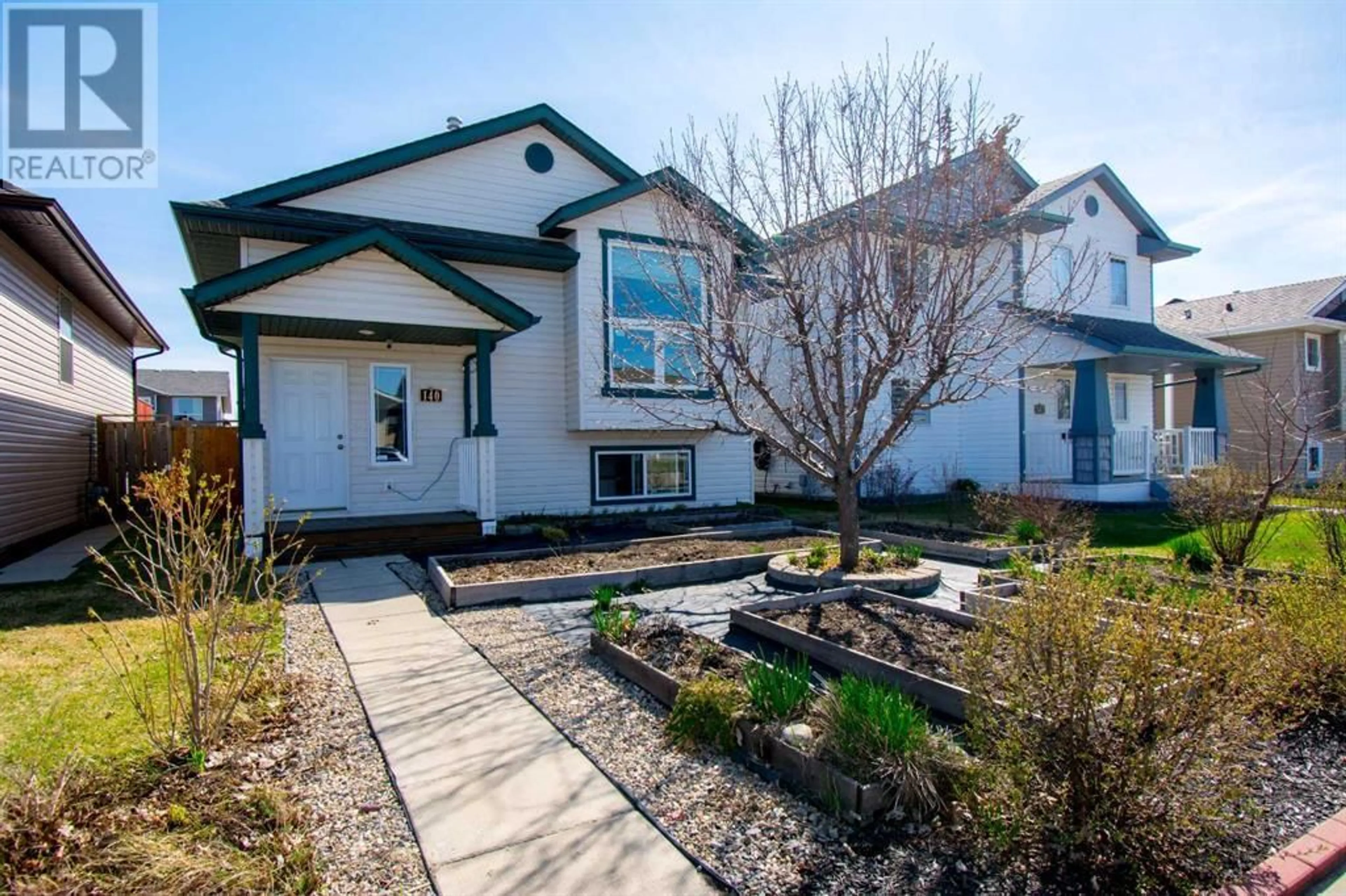 Frontside or backside of a home for 140 Lanterman Close, Red Deer Alberta T4P1R2