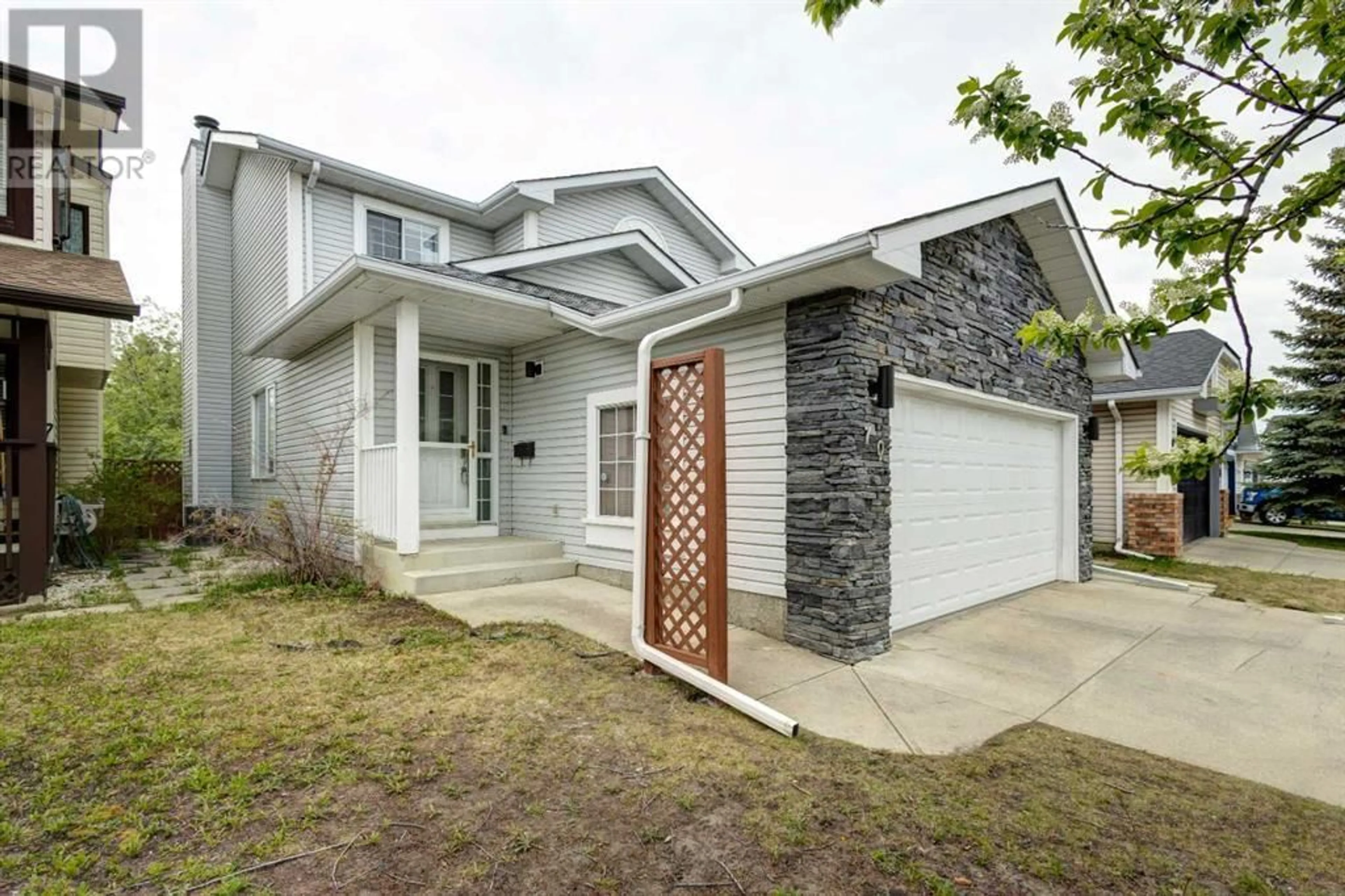 Frontside or backside of a home for 70 Riverwood Crescent SE, Calgary Alberta T2C4B2