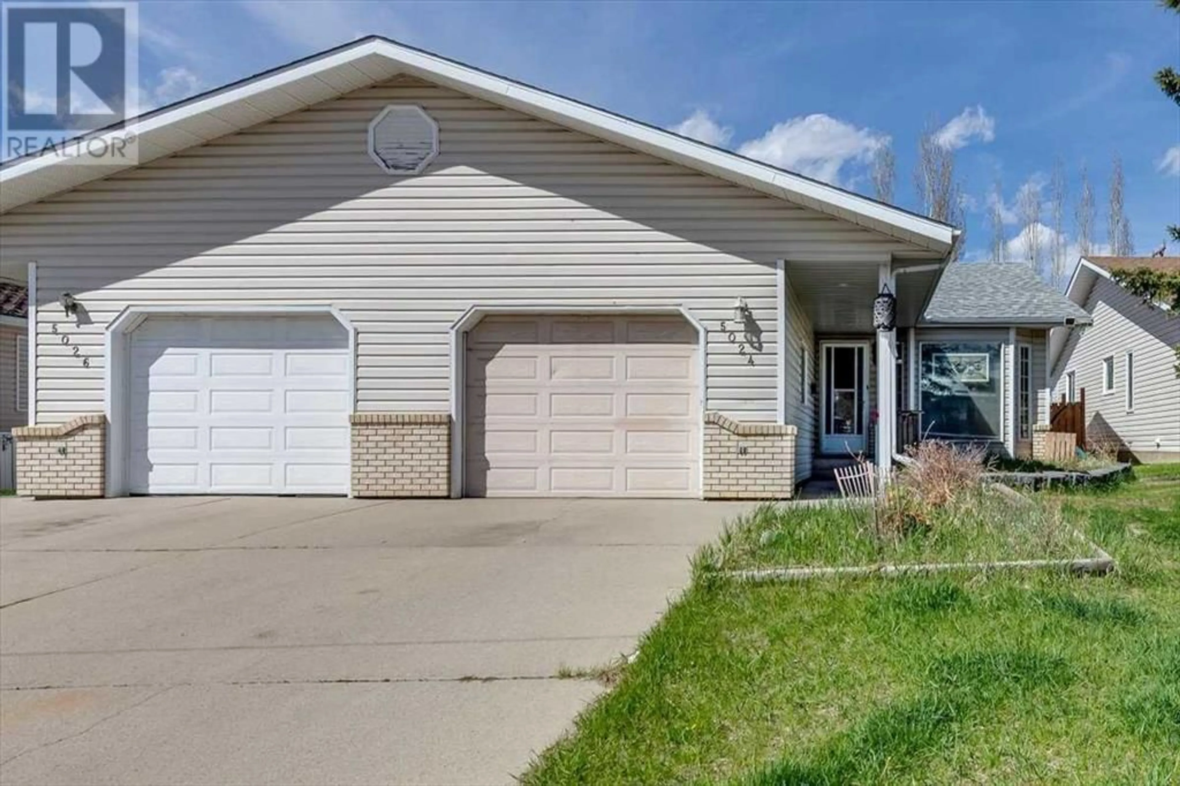 Frontside or backside of a home for 5024 48 Street, Innisfail Alberta T4G1M2