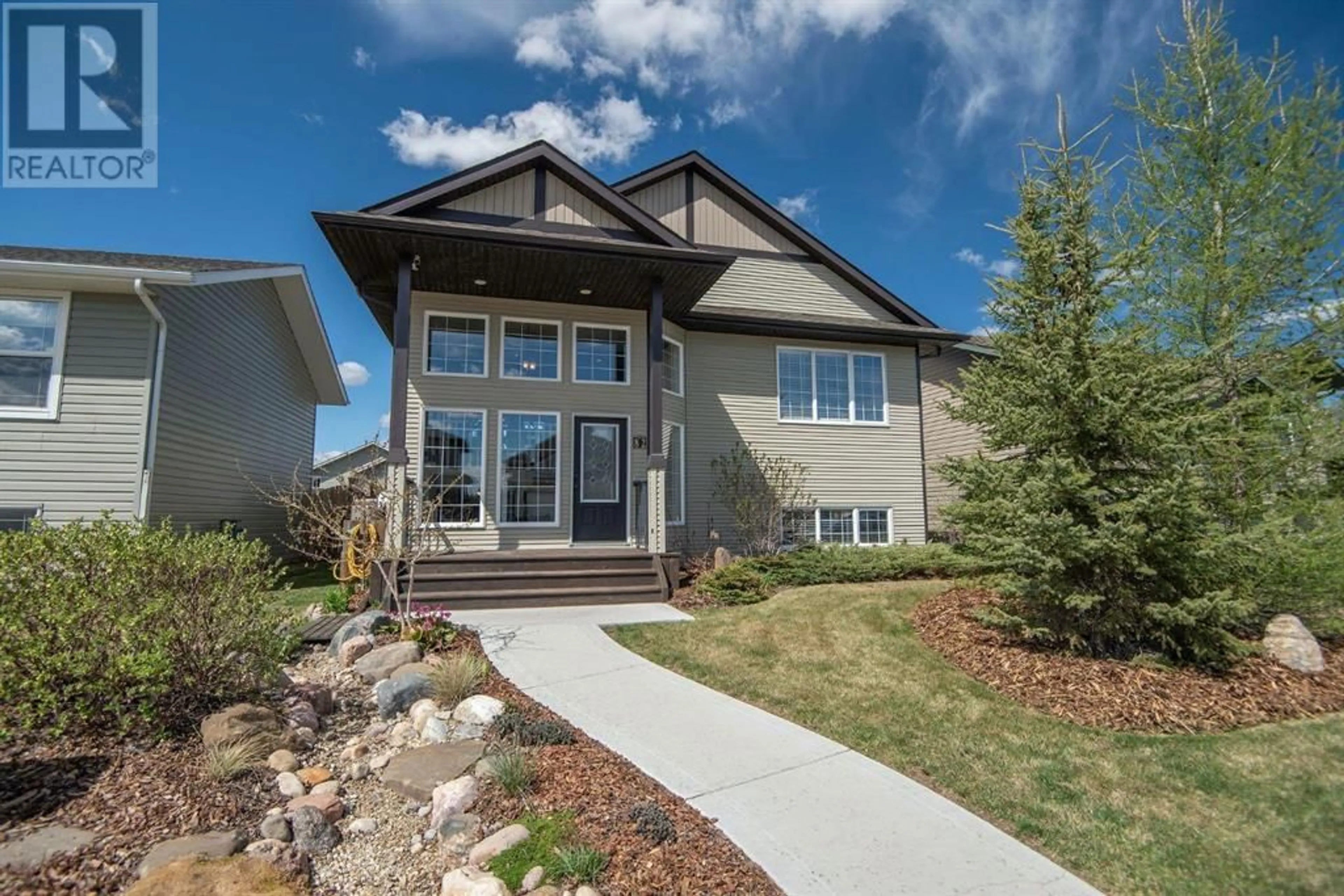 Frontside or backside of a home for 82 Mann Drive, Penhold Alberta T0M1R0