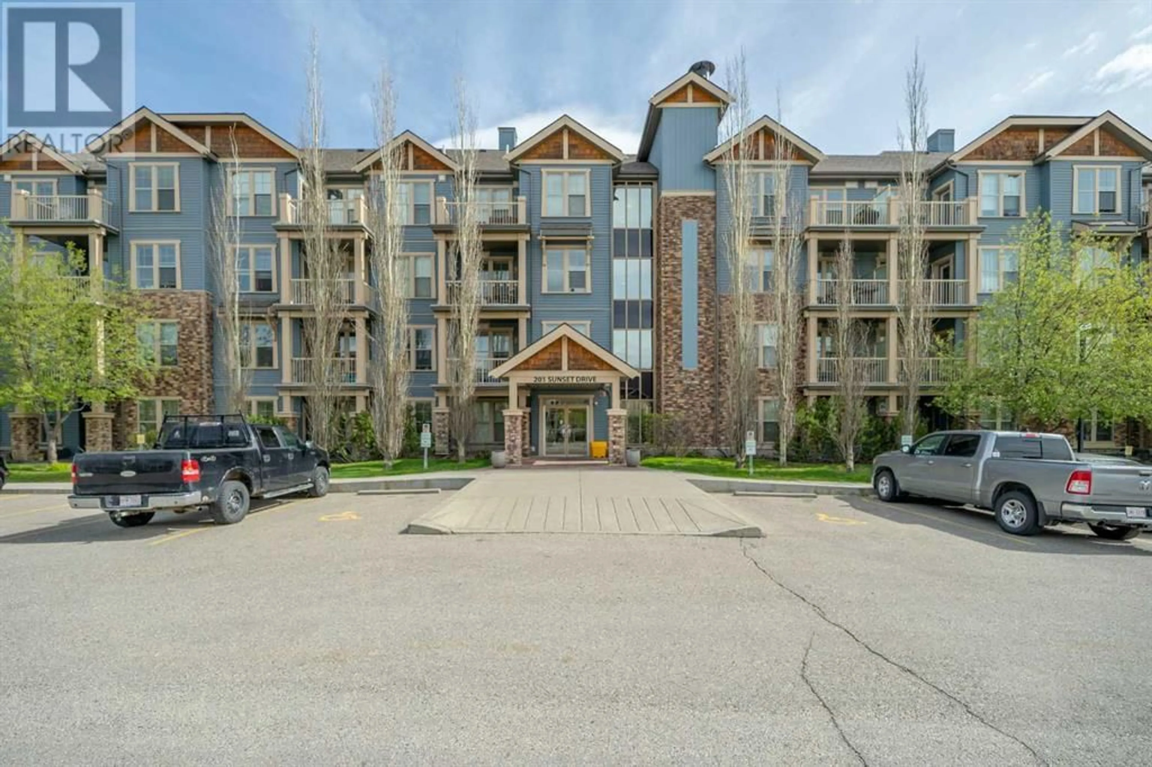 A pic from exterior of the house or condo for 310 201 Sunset Drive, Cochrane Alberta T4C0L2