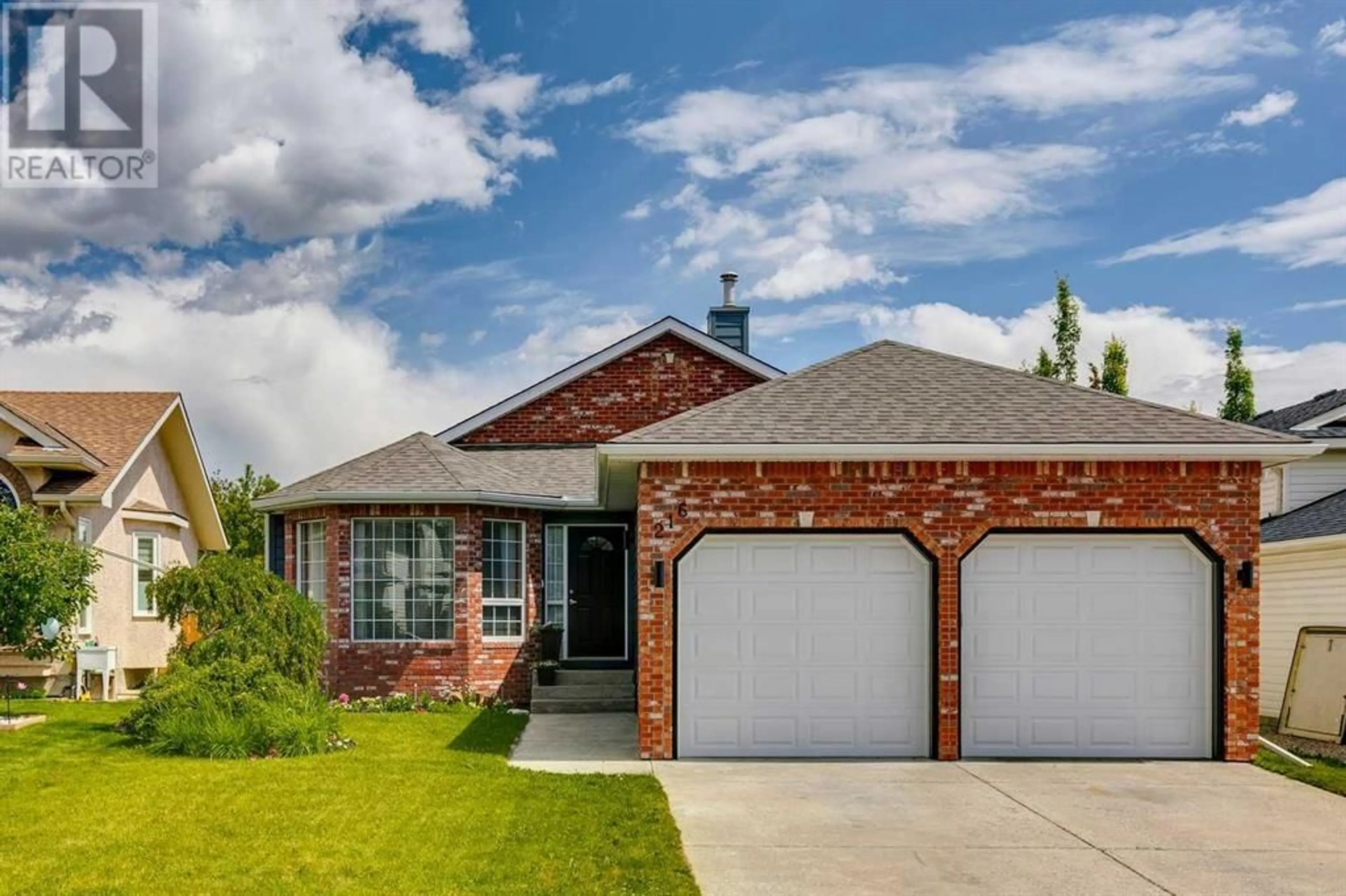 Home with brick exterior material for 216 Sunmeadows Crescent SE, Calgary Alberta T2X3G9