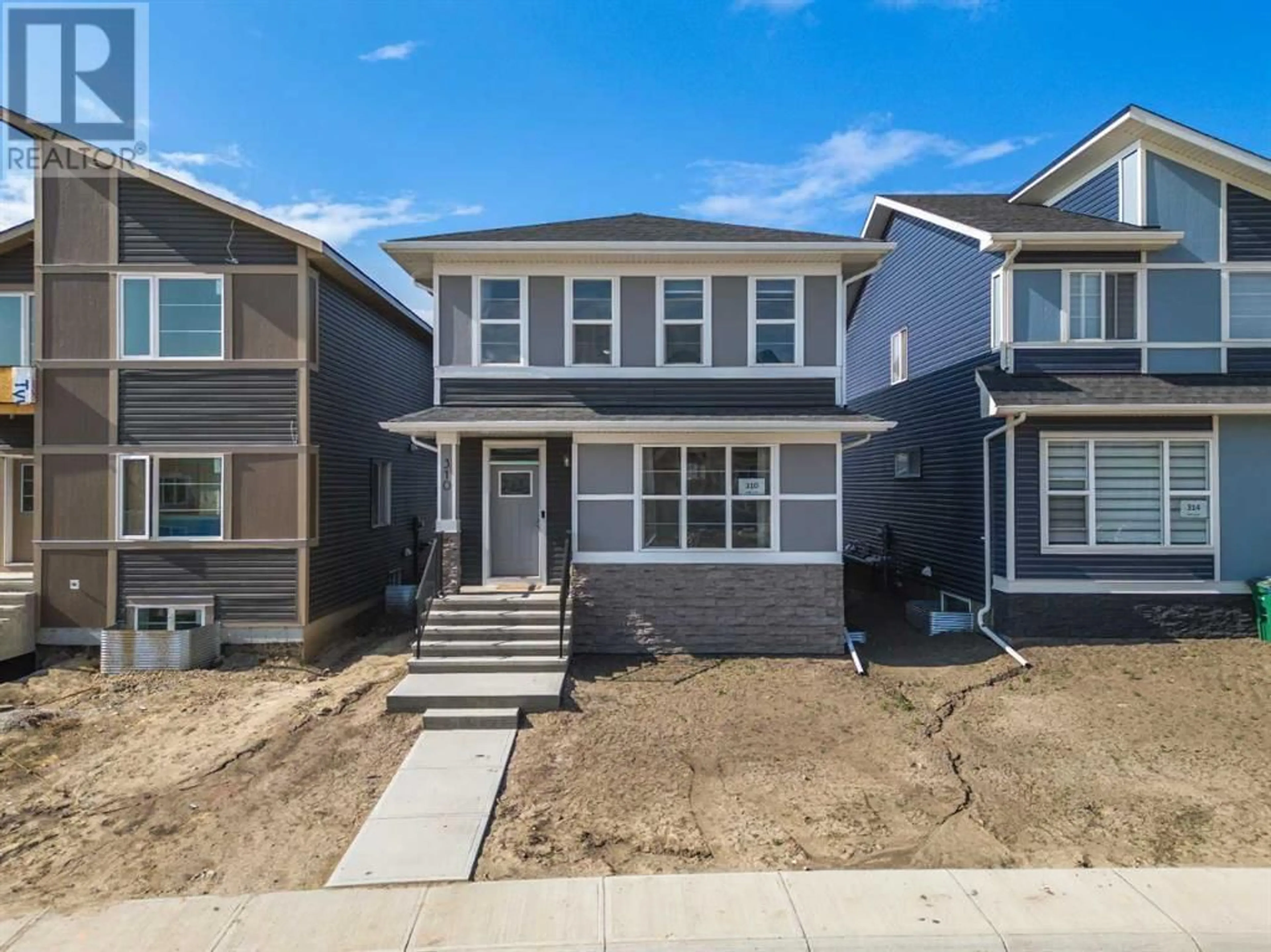 Frontside or backside of a home for 310 Midgrove Link SW, Airdrie Alberta T4B5K8