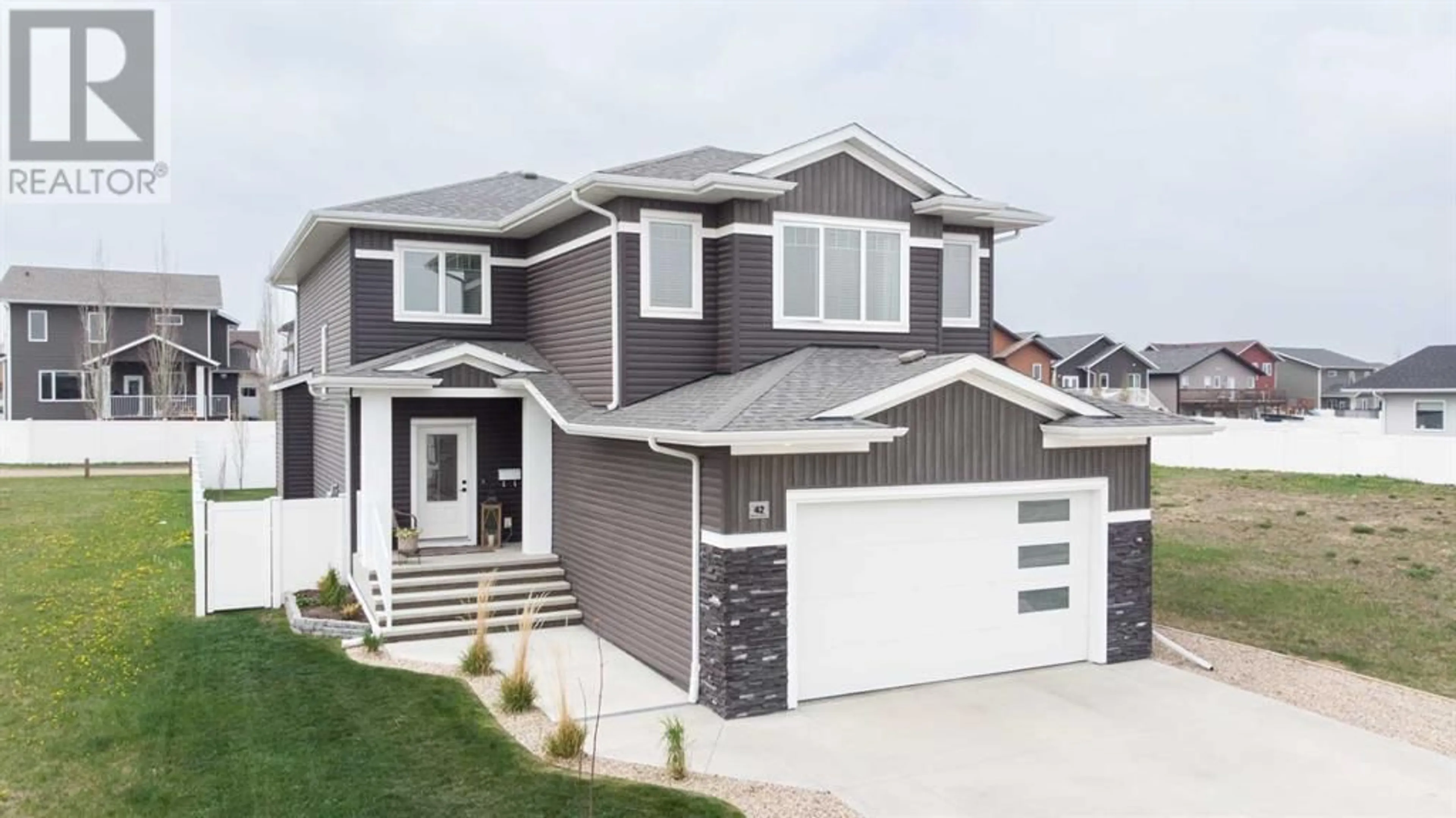 Frontside or backside of a home for 42 Mitchell Crescent, Blackfalds Alberta T4M0H5