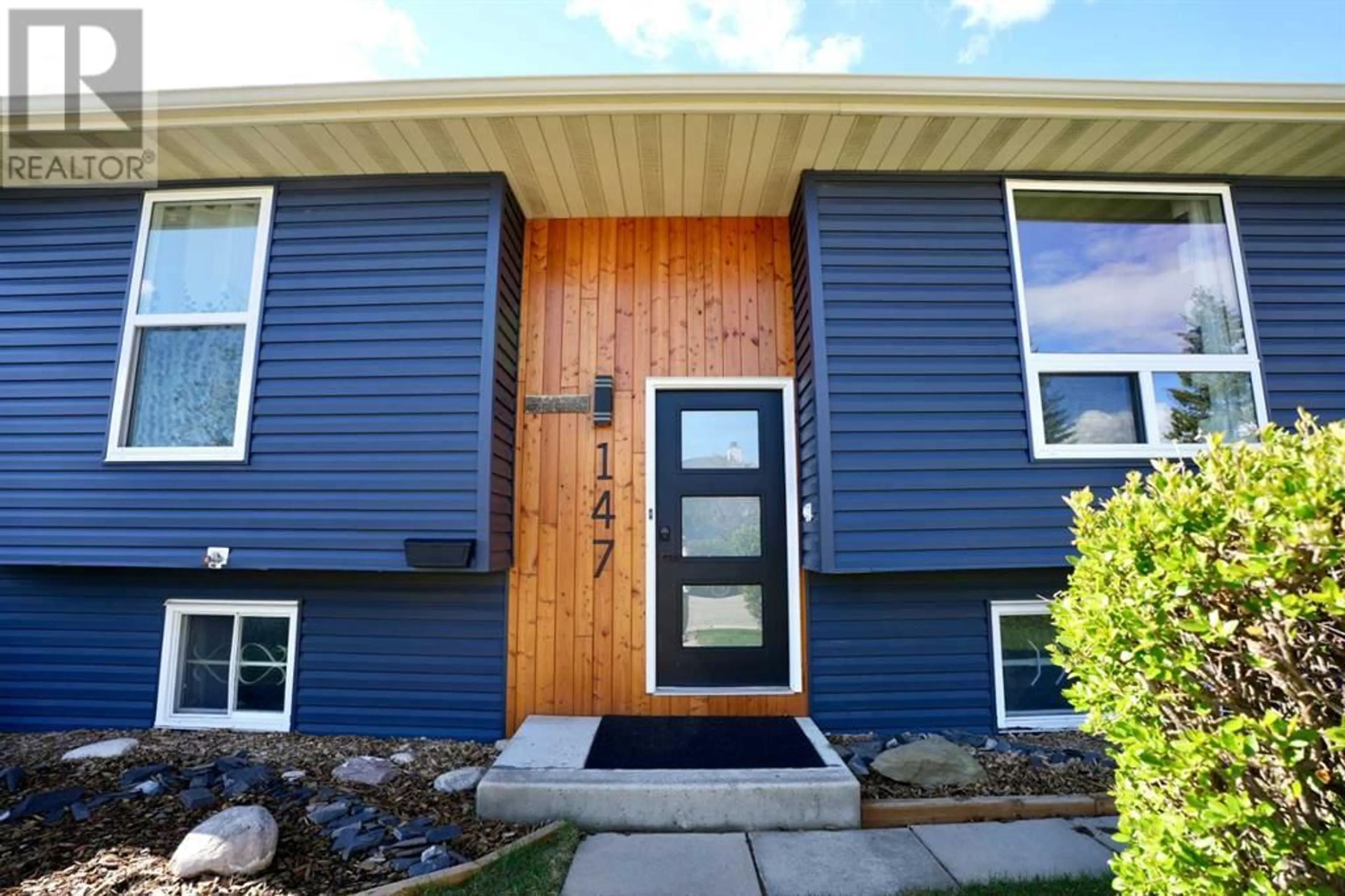 Home with vinyl exterior material for 147 Falchurch Crescent NE, Calgary Alberta T3J1J9