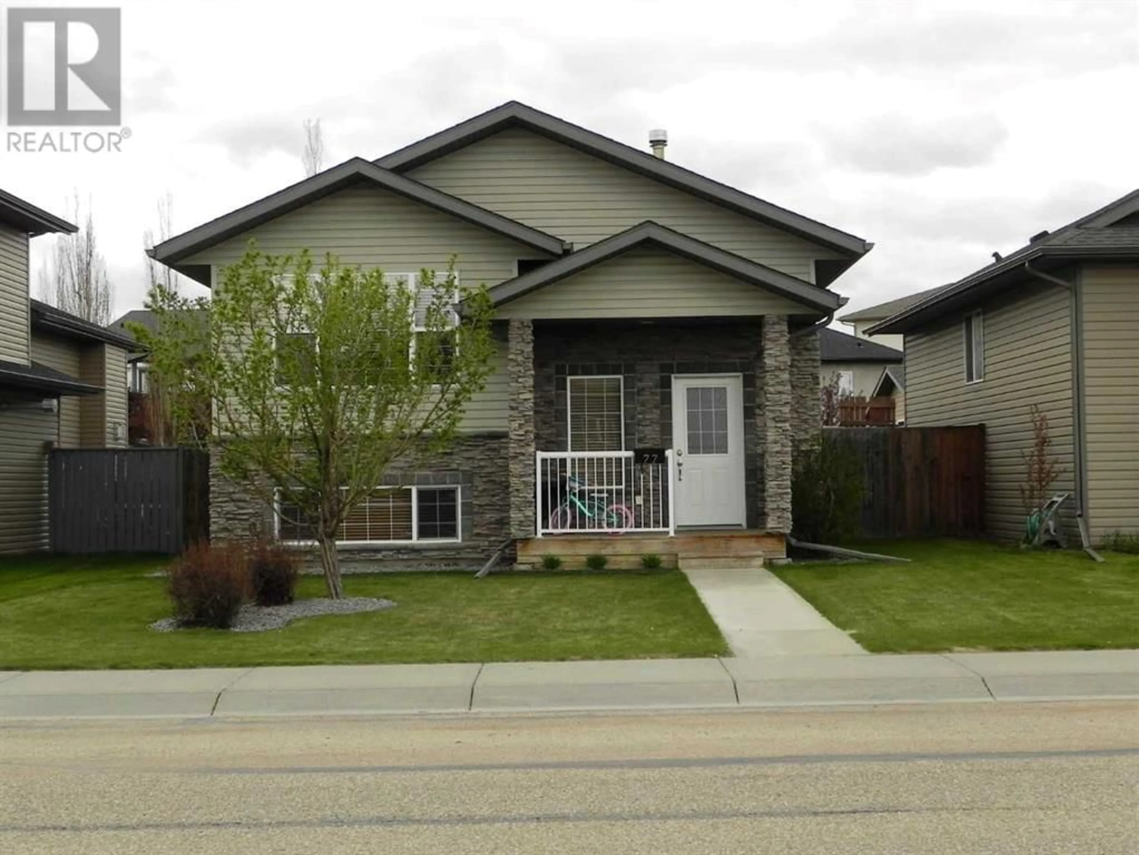 Frontside or backside of a home for 77 Terrace Heights Drive, Lacombe Alberta T4L0A2