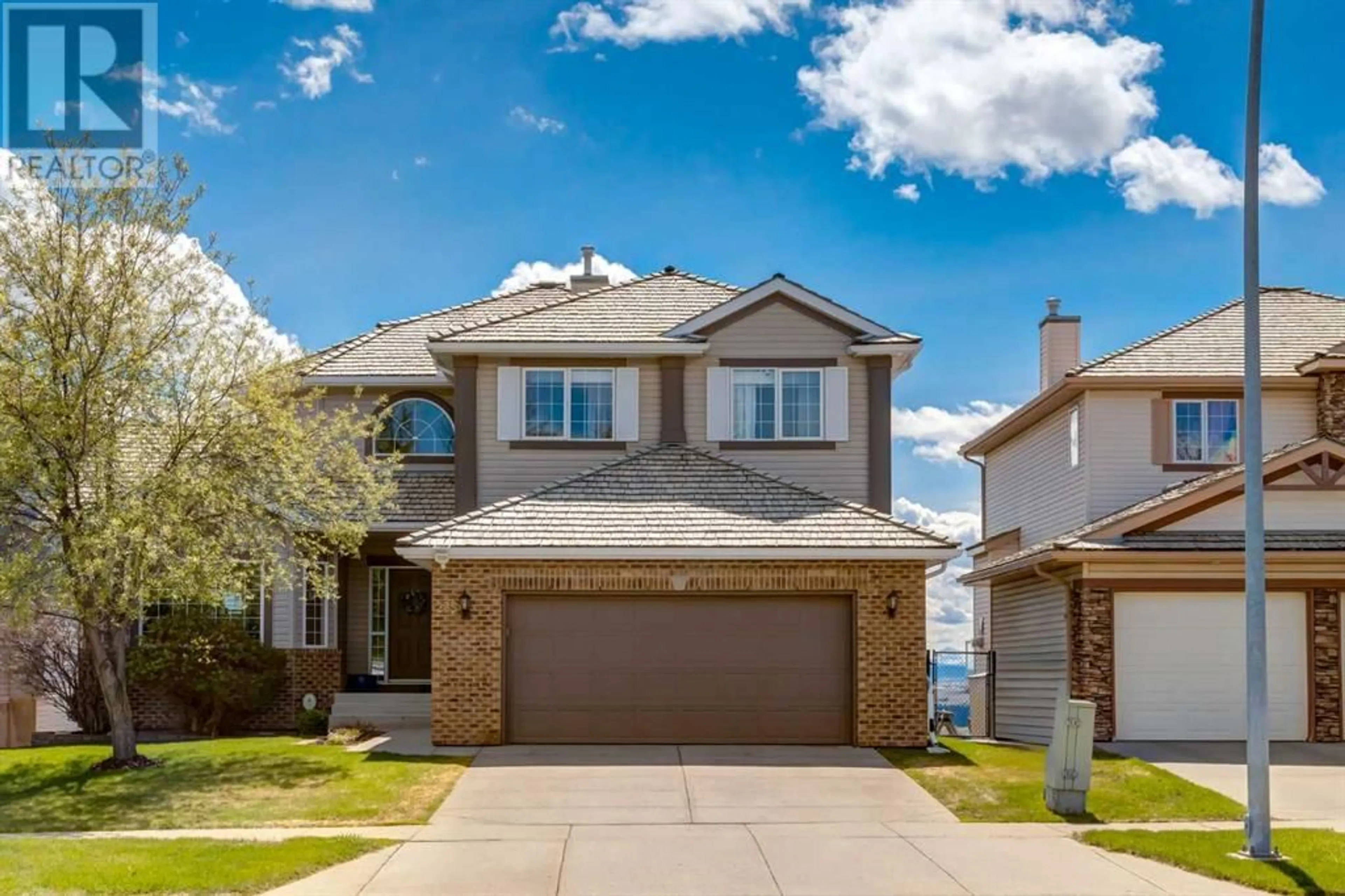 Frontside or backside of a home for 235 Rocky Ridge Drive NW, Calgary Alberta T3G4M1