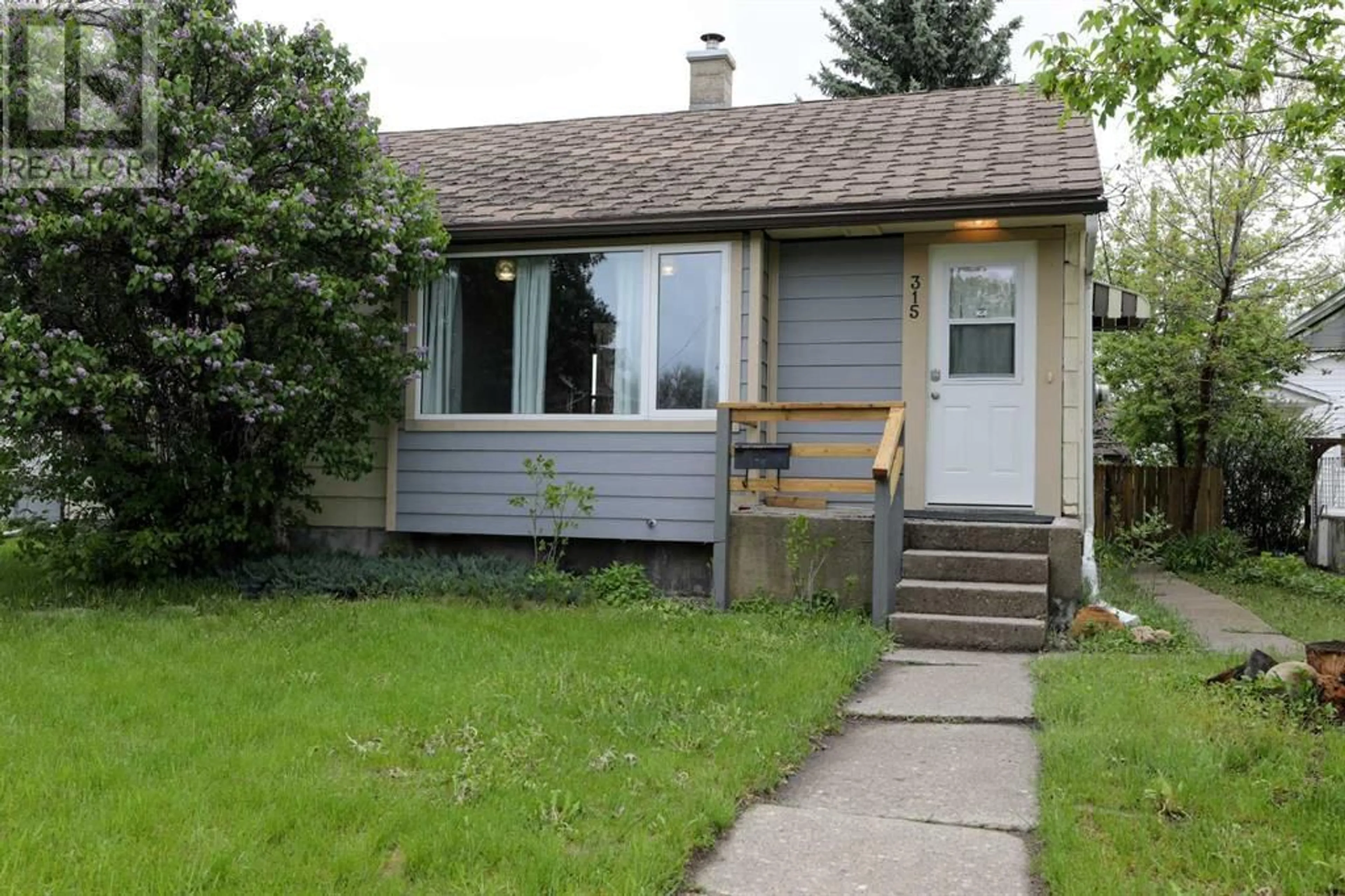Frontside or backside of a home for 315 16 Street N, Lethbridge Alberta T1H3A2