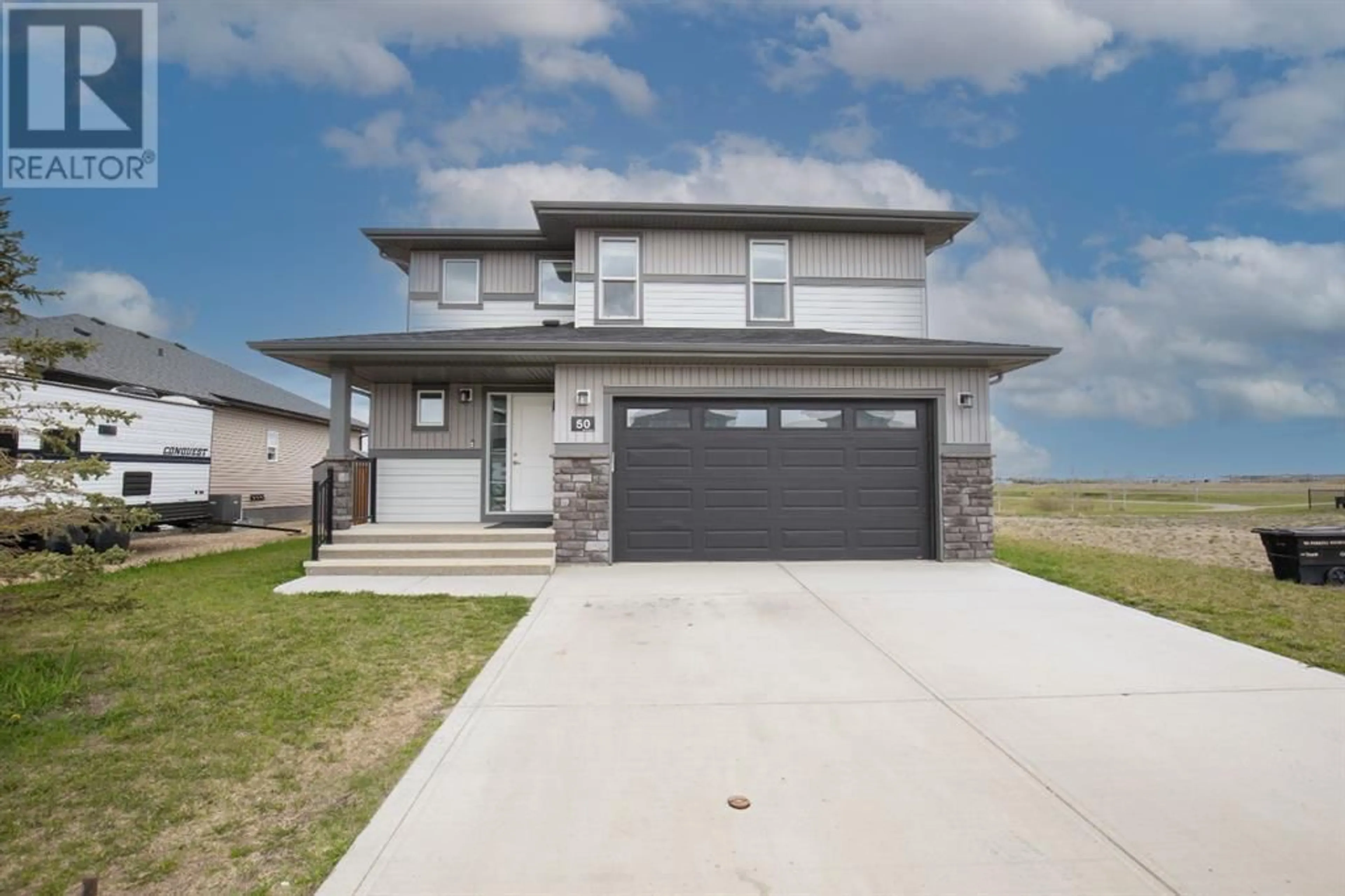 Frontside or backside of a home for 50 Mackenzie Avenue, Lacombe Alberta T4L0A6
