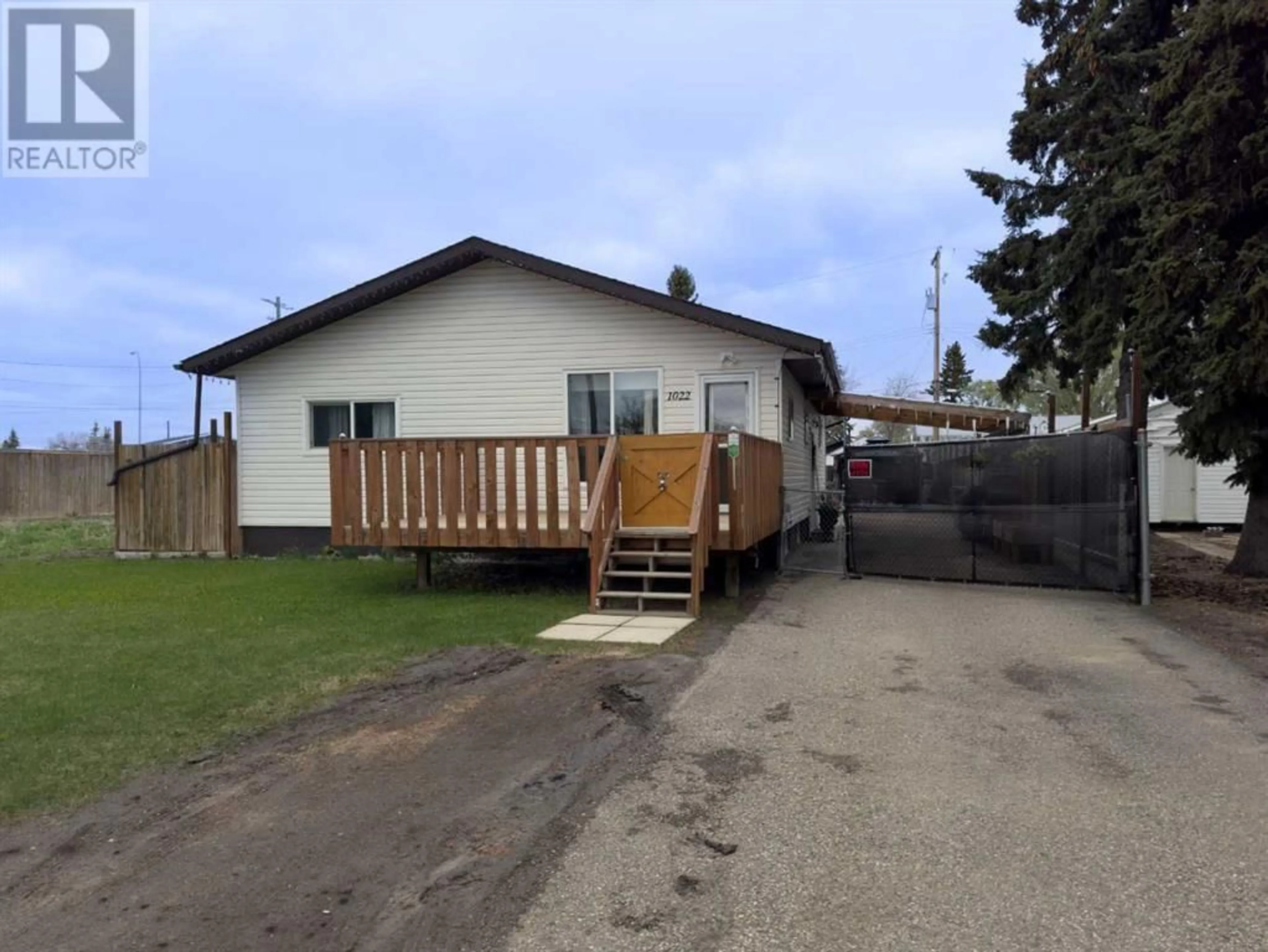 Frontside or backside of a home for 1022 11 Avenue, Wainwright Alberta T9W1K6