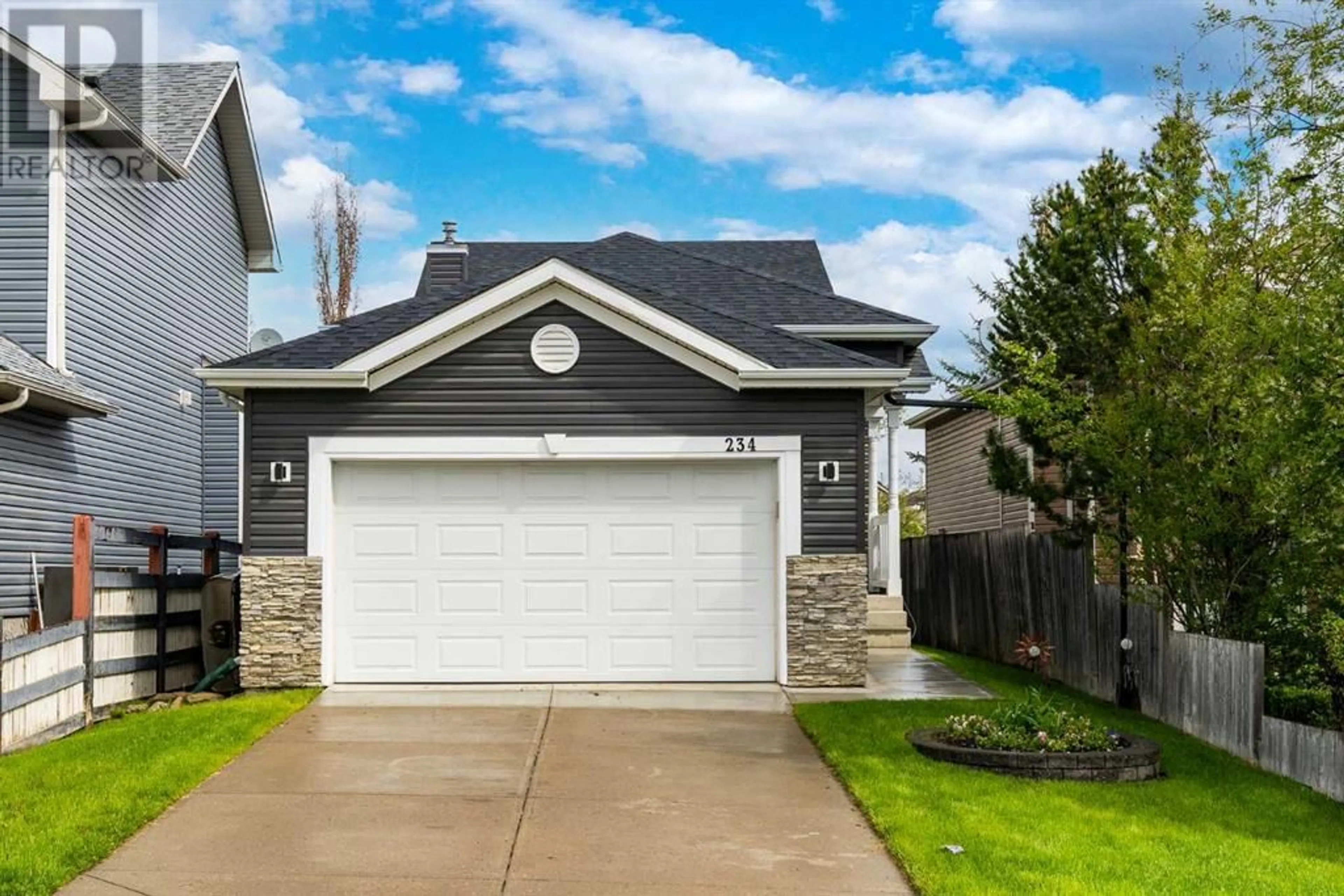 Frontside or backside of a home for 234 Bridlewood Road SW, Calgary Alberta T2Y3X2