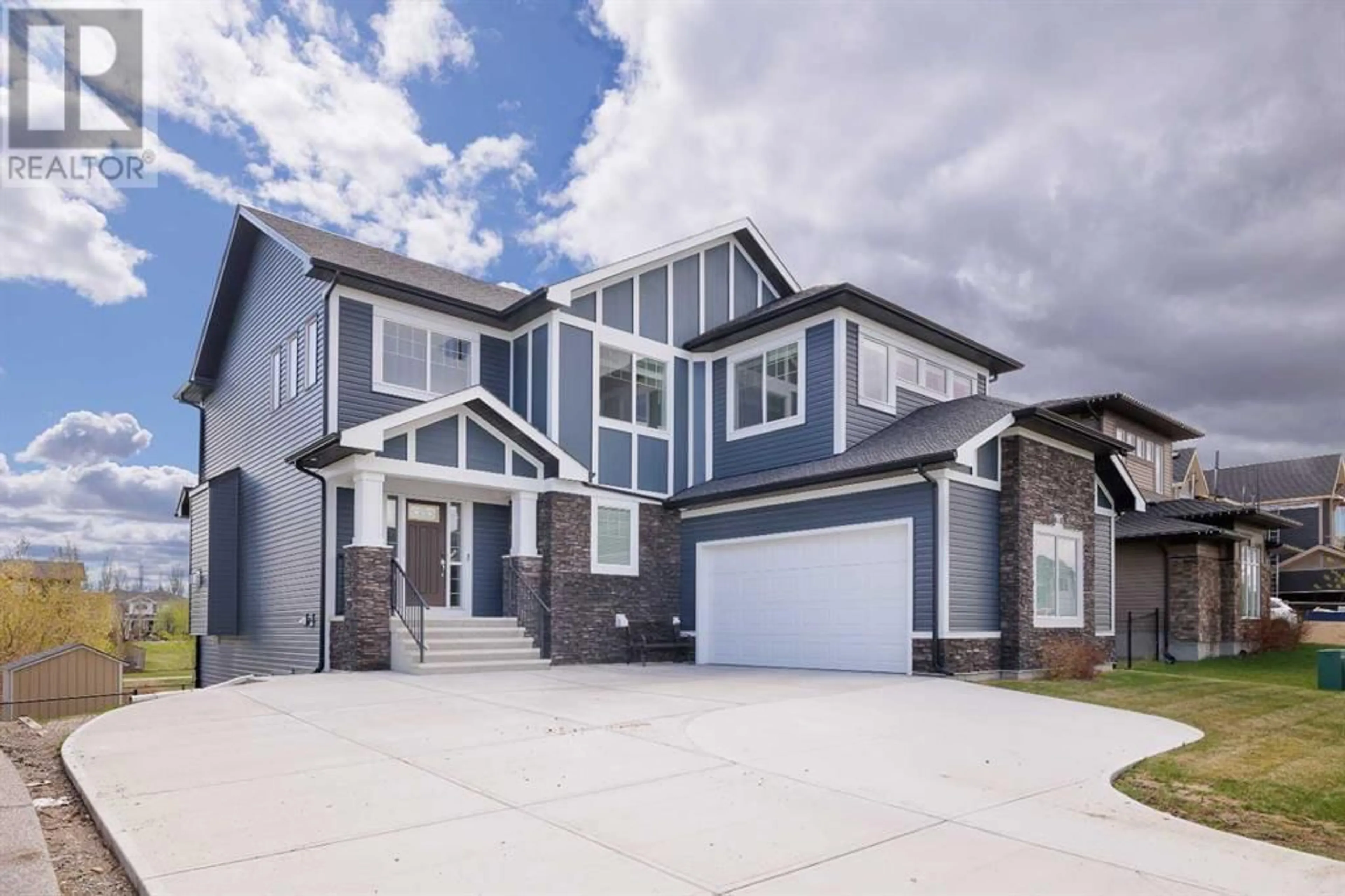 Frontside or backside of a home for 146 Canoe Crescent SW, Airdrie Alberta T4B2N9
