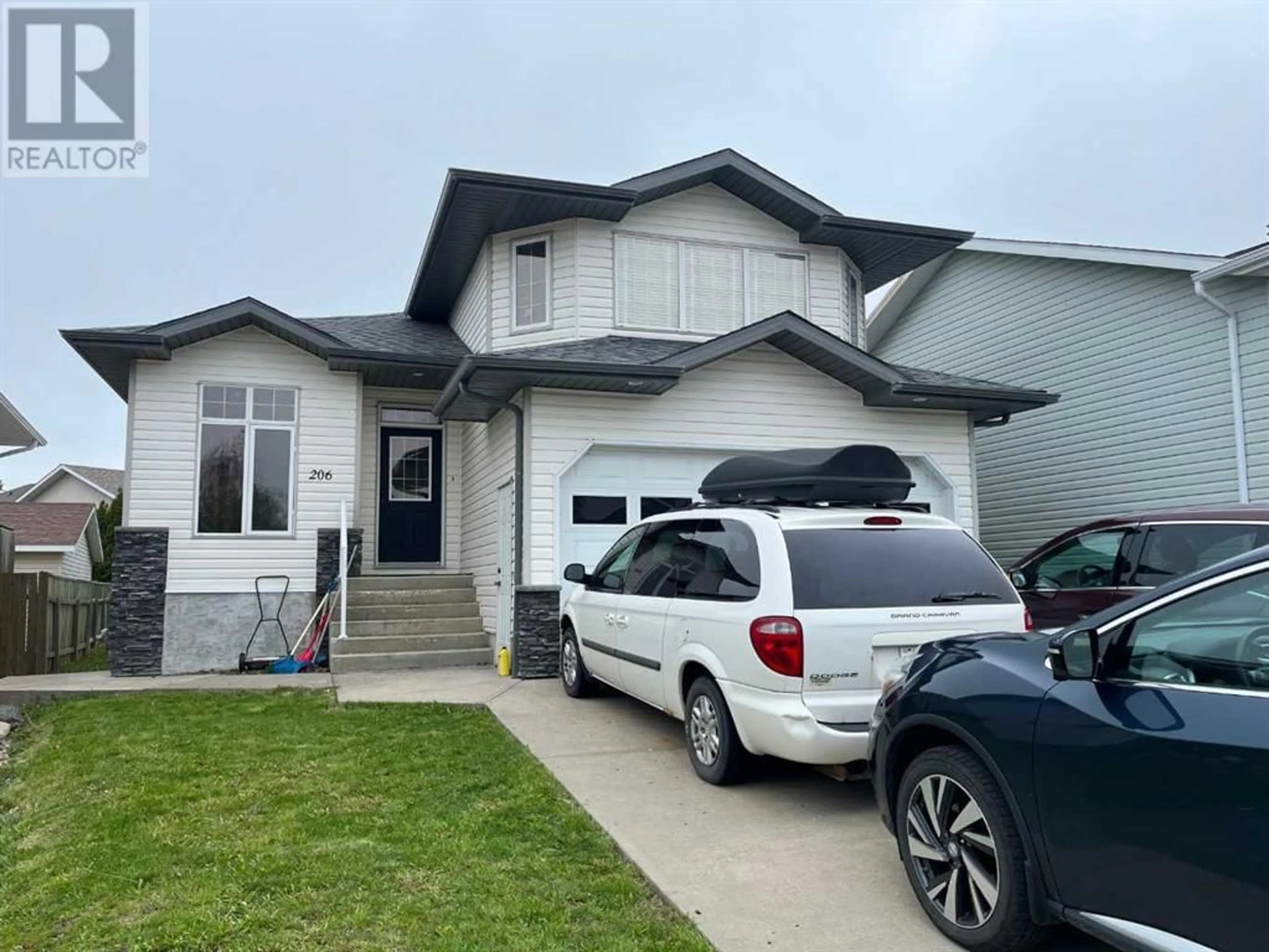 Frontside or backside of a home for 206 Chilcotin Road W, Lethbridge Alberta T1K7N1