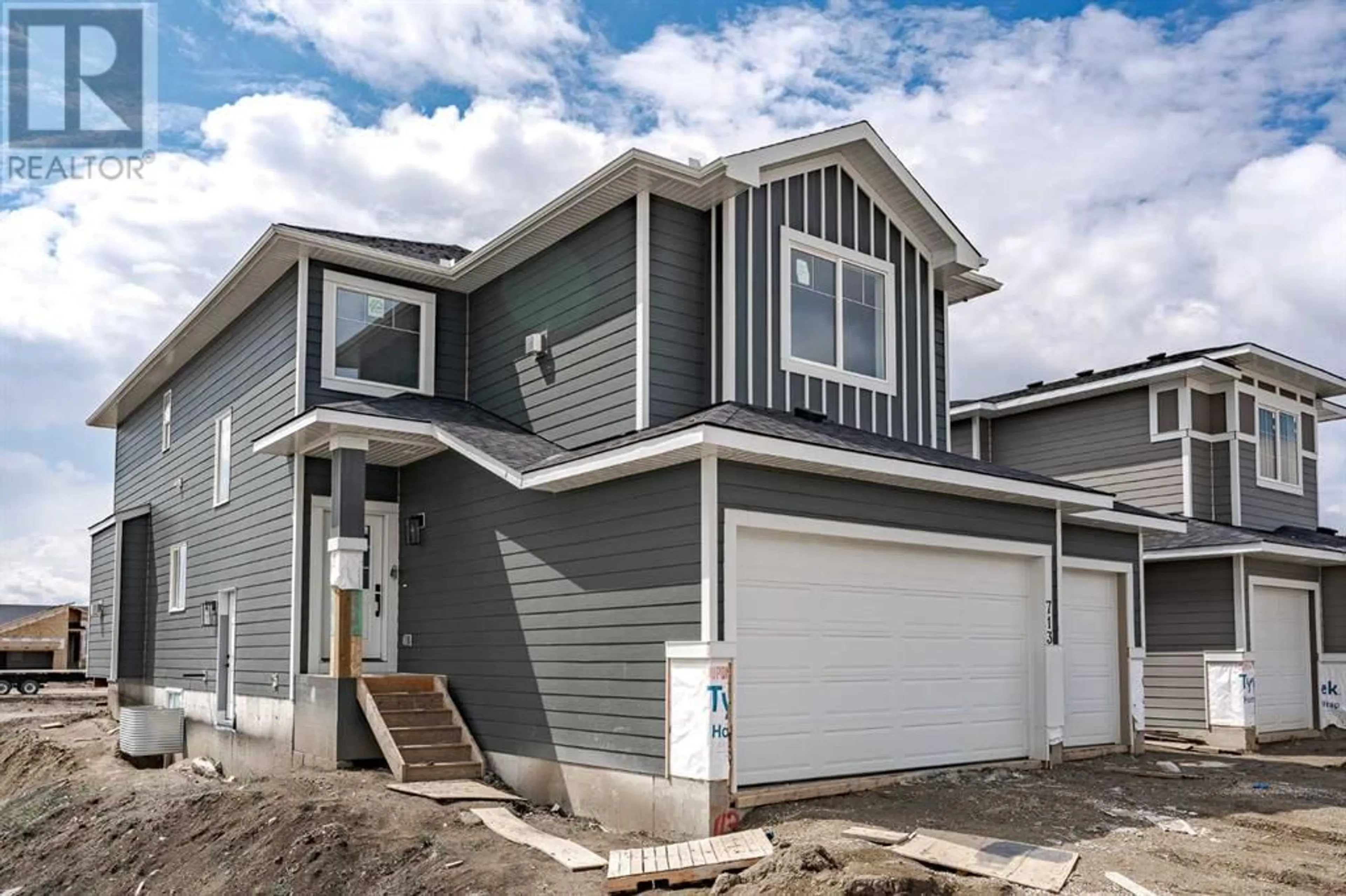 Frontside or backside of a home for 713 Mandalay Link, Carstairs Alberta T0M0N0