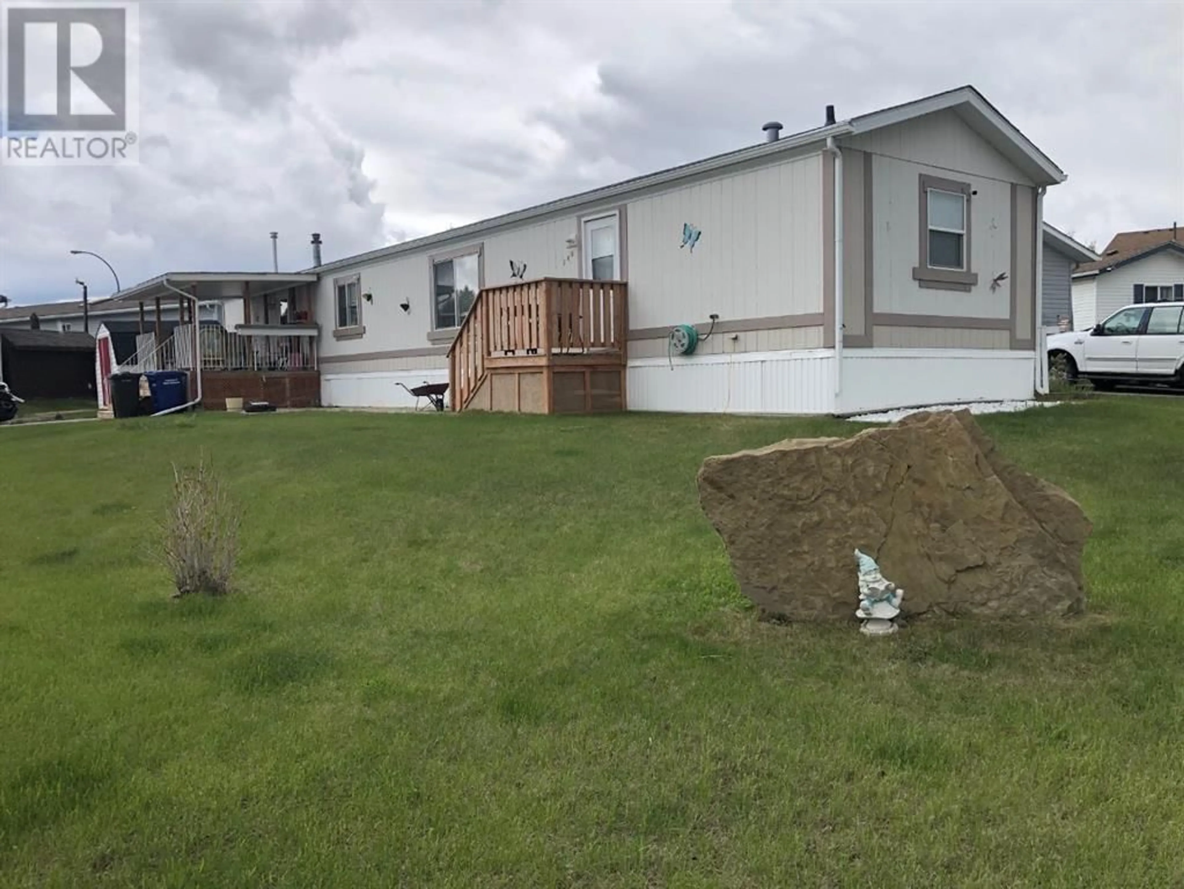Frontside or backside of a home for 209 2 Avenue SE, Diamond Valley Alberta T0L0H0
