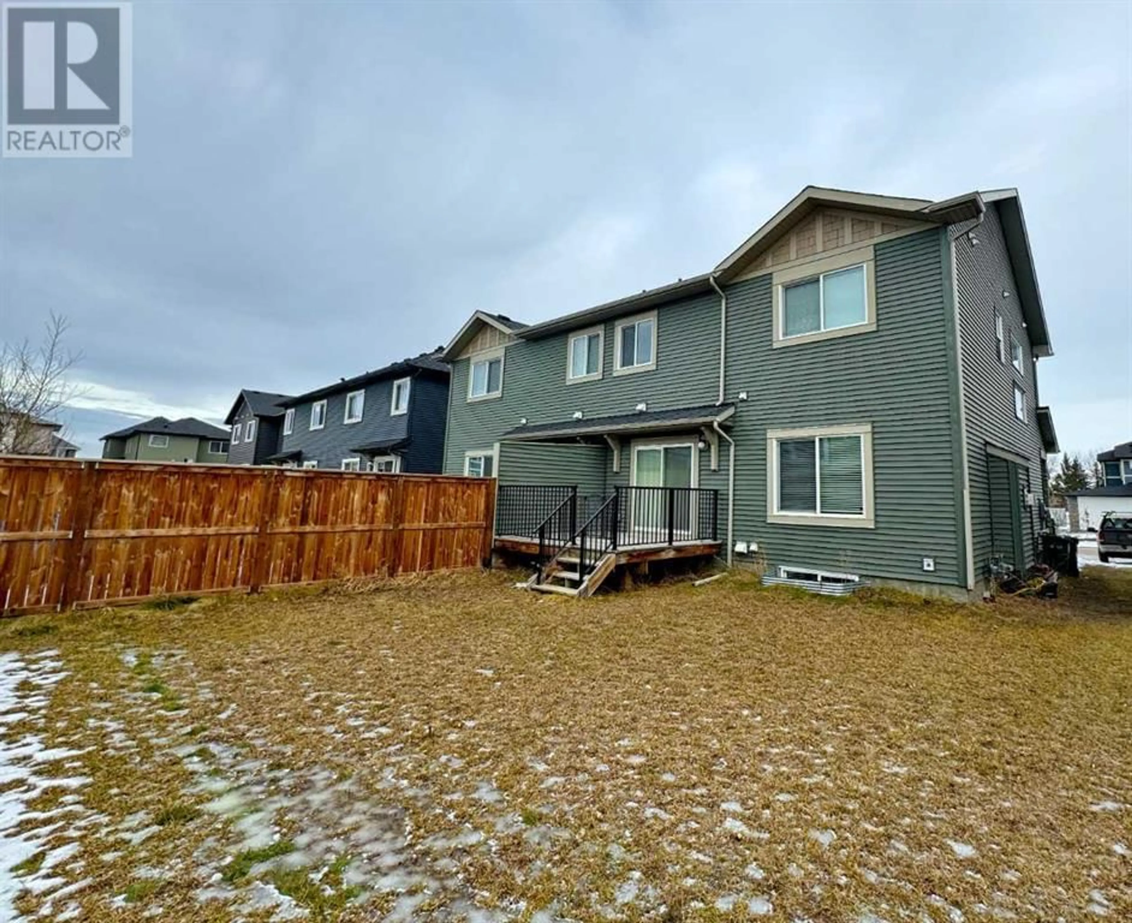 A pic from outside/outdoor area/front of a property/back of a property/a pic from drone, water/lake/river/ocean view for 251 Kinniburgh Road, Chestermere Alberta T1X0Y7