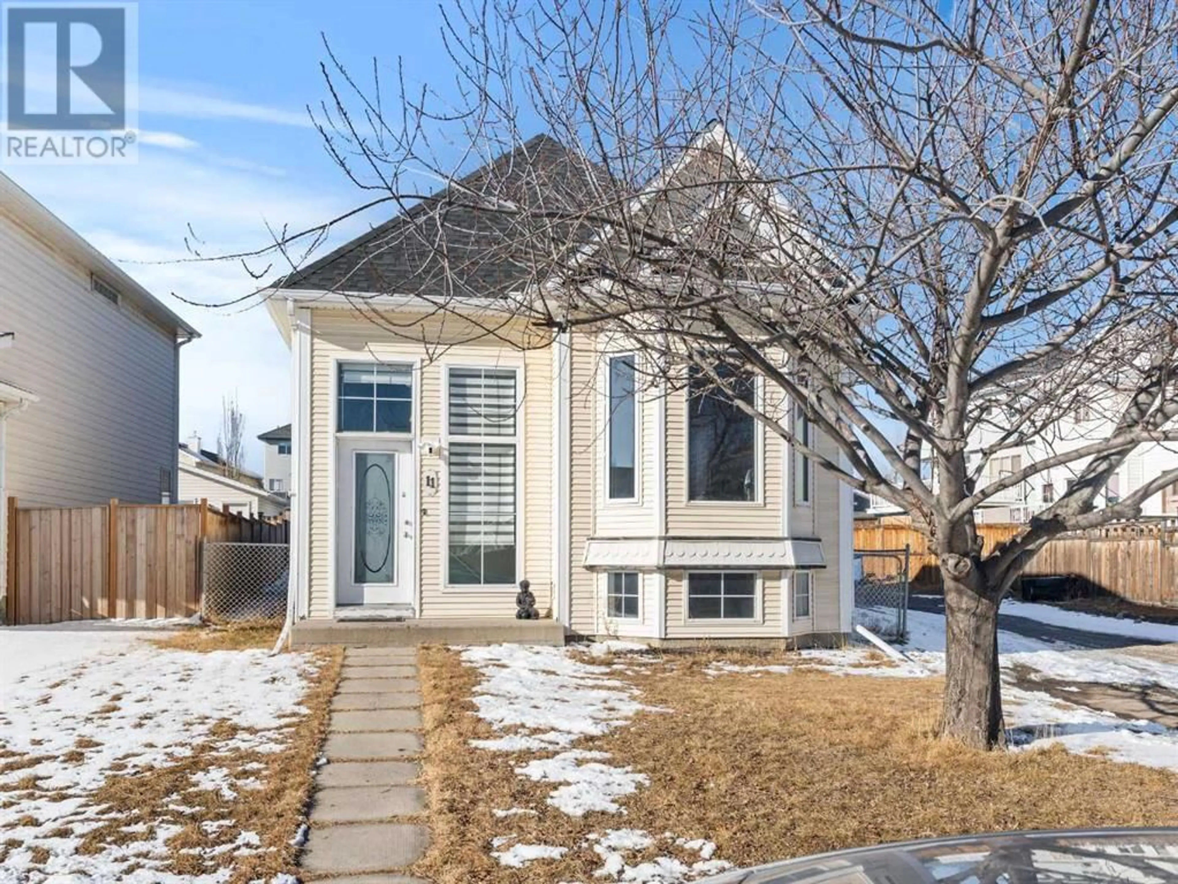 Home with brick exterior material, street for 11 Hidden Crescent NW, Calgary Alberta T3A5L2