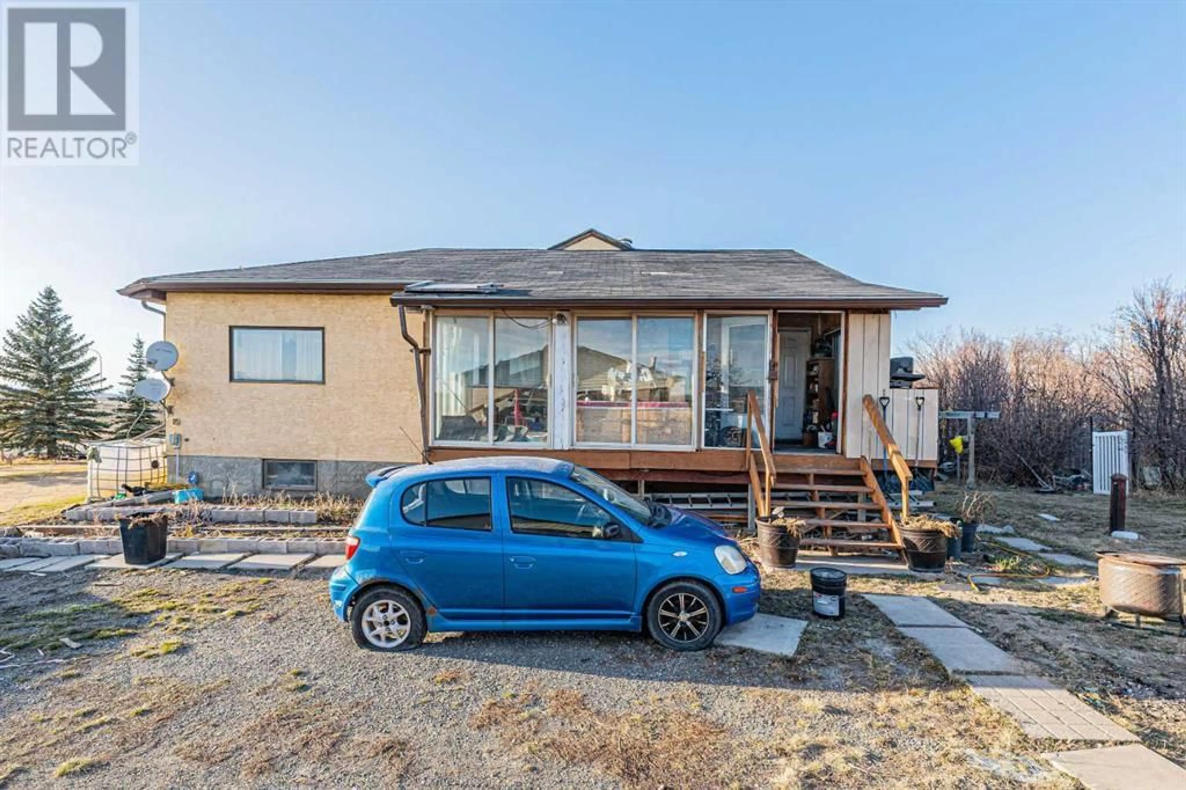 A pic from outside/outdoor area/front of a property/back of a property/a pic from drone, street for 266110 1014 DRIVE EAST, Rural Foothills County Alberta T1S4S5