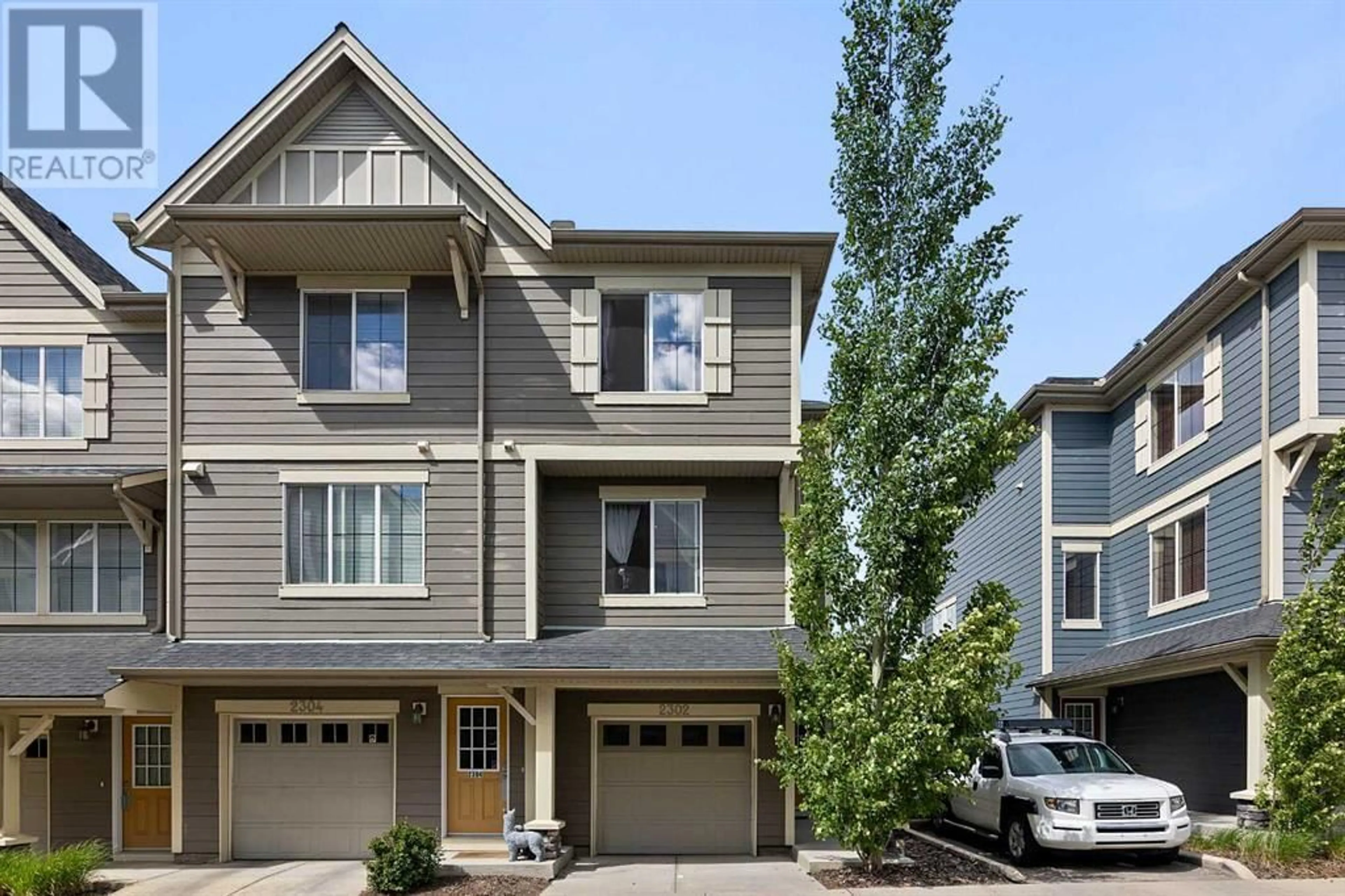Home with vinyl exterior material, street for 125 PANATELLA WAY NORTHWEST, Calgary Alberta T3K0R9