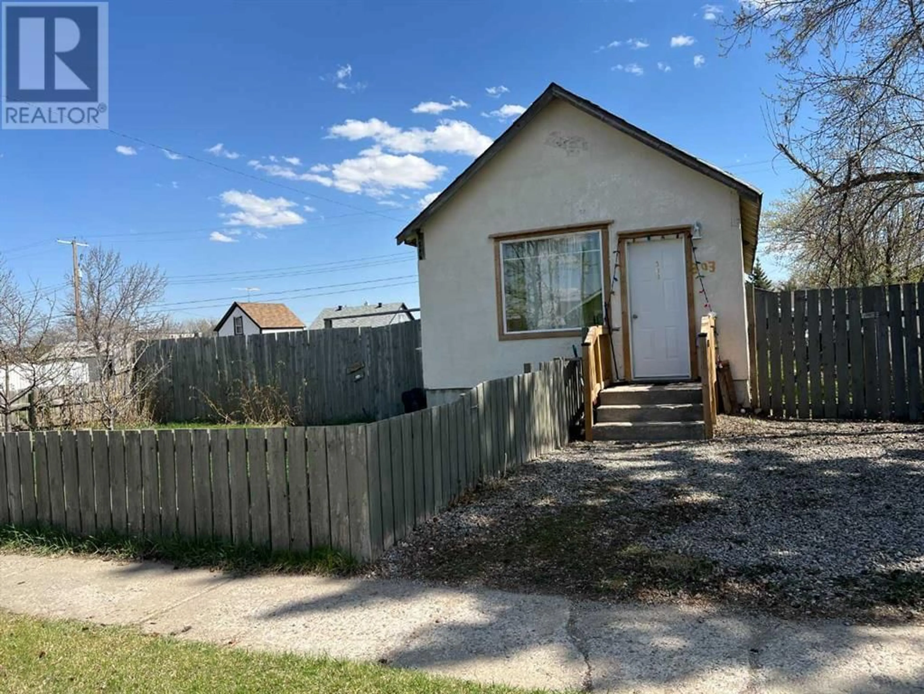 A pic from outside/outdoor area/front of a property/back of a property/a pic from drone, street for 303 2 STREET NORTH, Vulcan Alberta T0L2B0