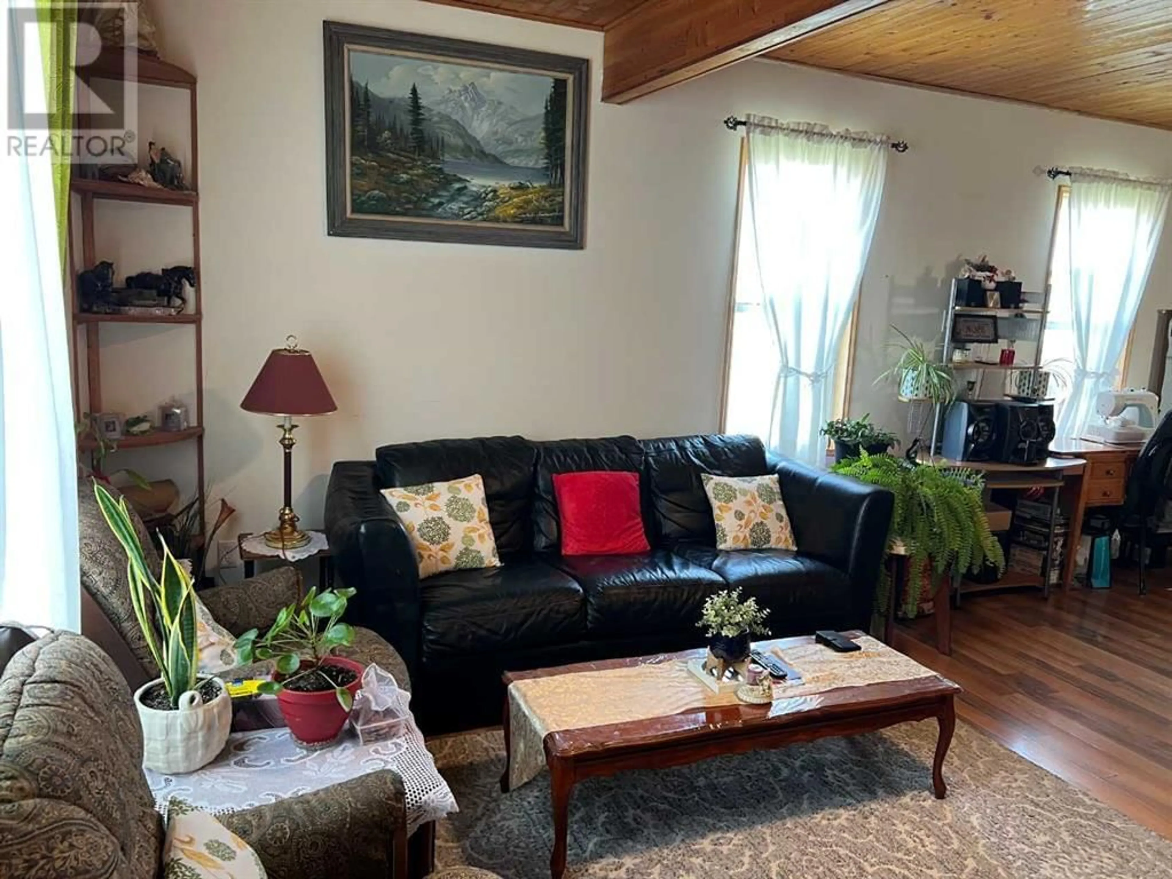Living room with furniture, wood/laminate floor for 303 2 STREET NORTH, Vulcan Alberta T0L2B0