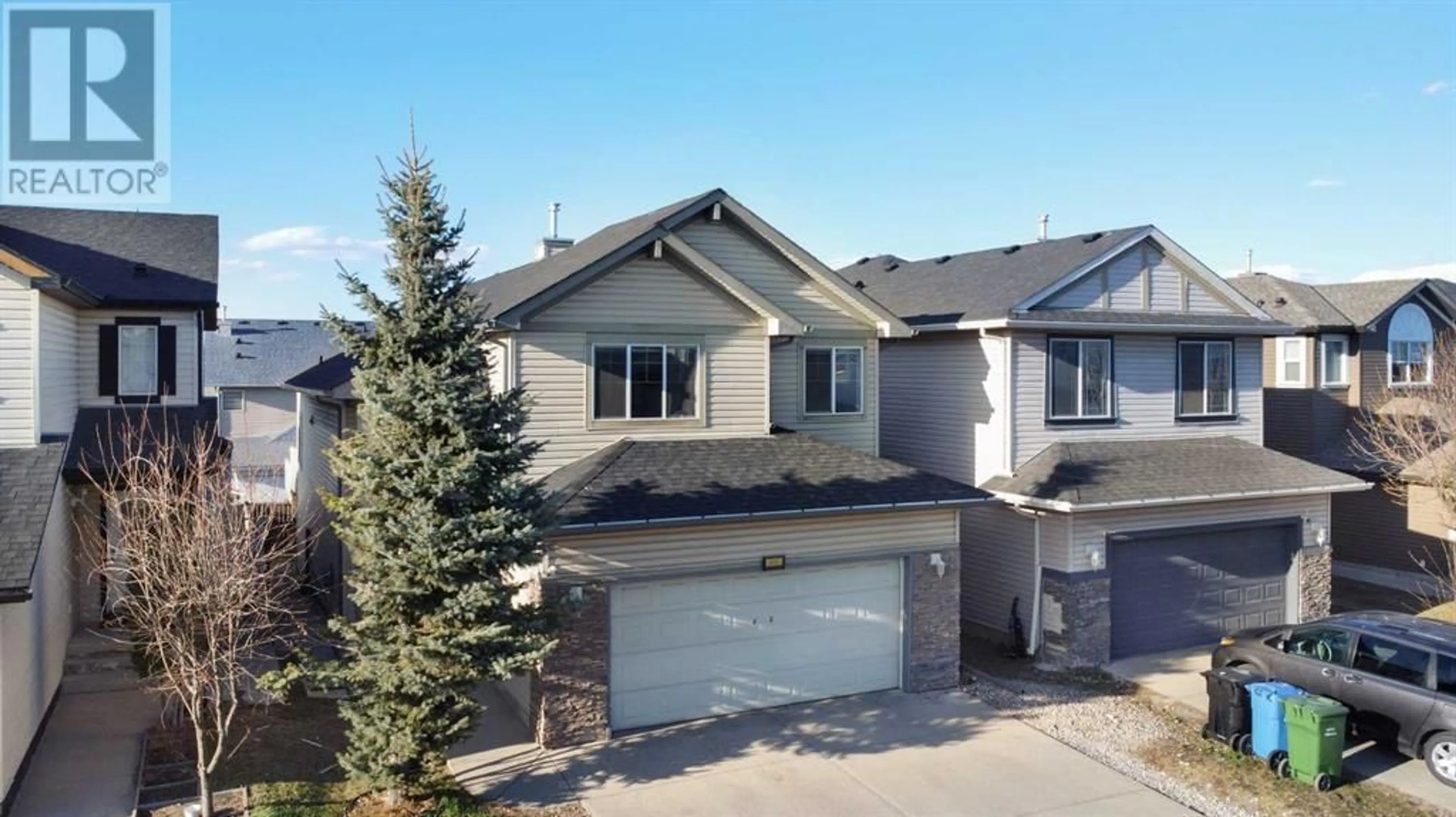 Home with vinyl exterior material, street for 66 SADDLECREST TERRACE NORTHEAST, Calgary Alberta T3J5L7