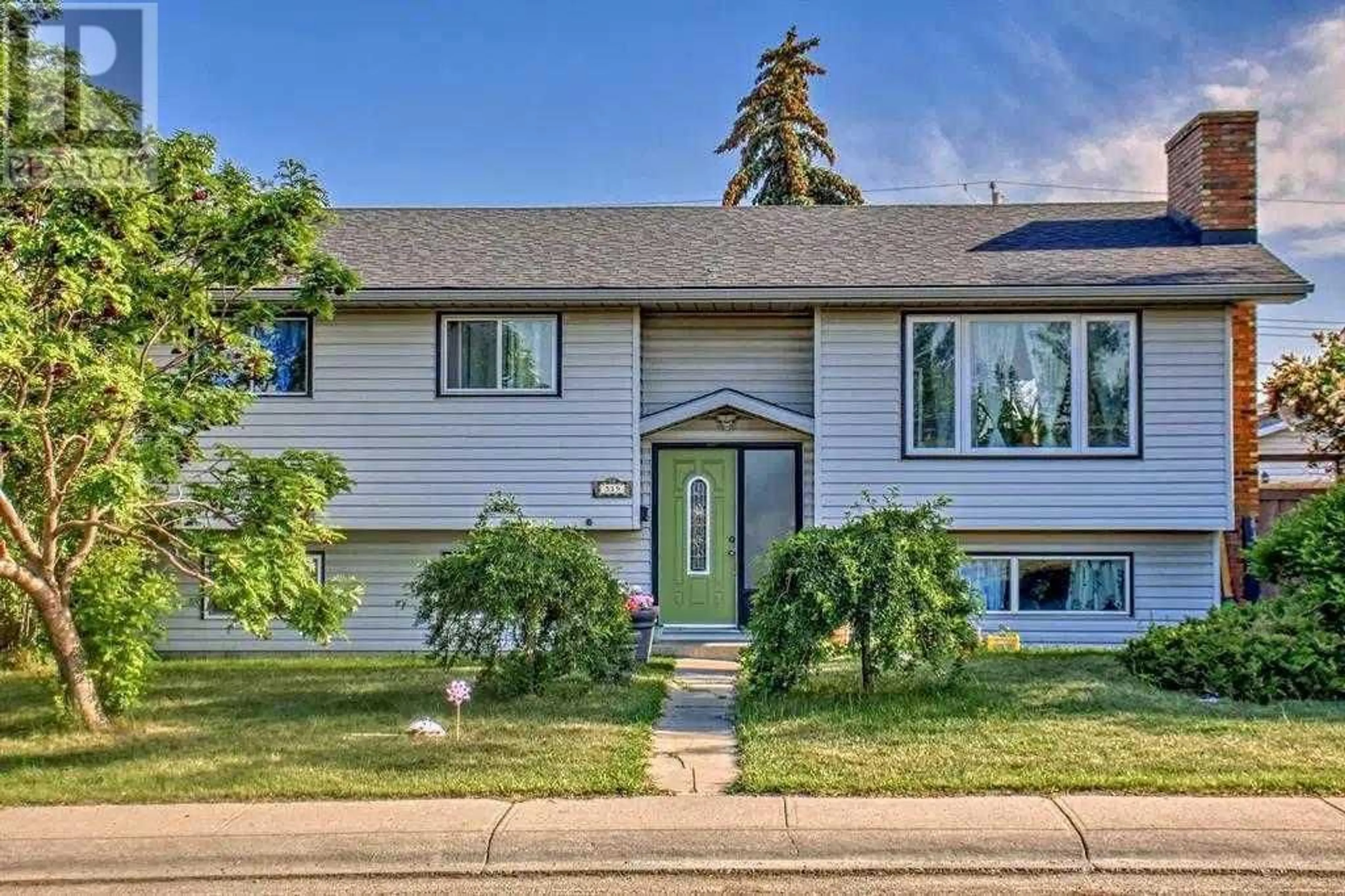 Home with vinyl exterior material, street for 319 MANORA DRIVE NORTHEAST, Calgary Alberta T2A4R2