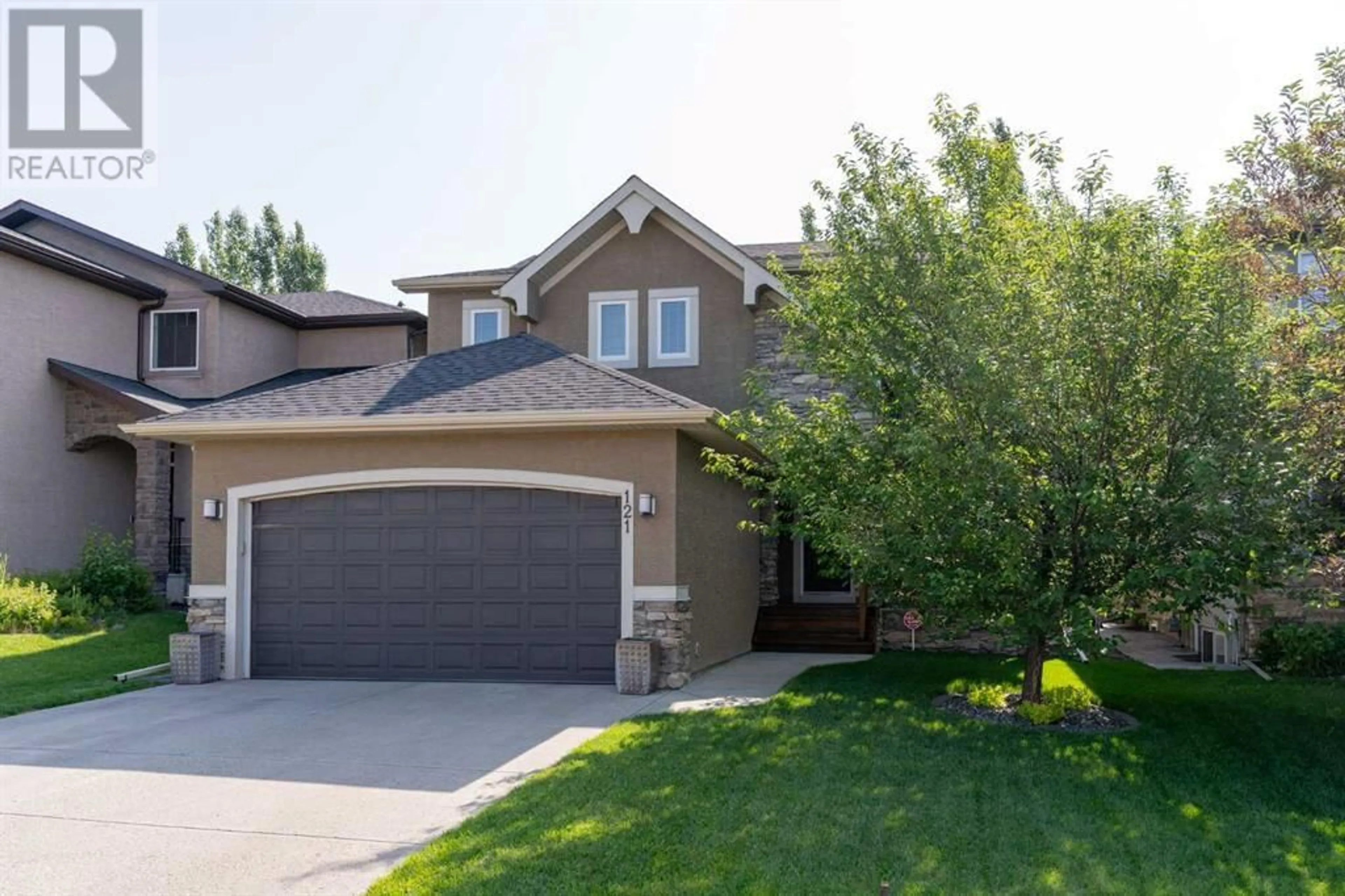 Home with vinyl exterior material, street for 121 PANATELLA GREEN NORTHWEST, Calgary Alberta T3K0M6