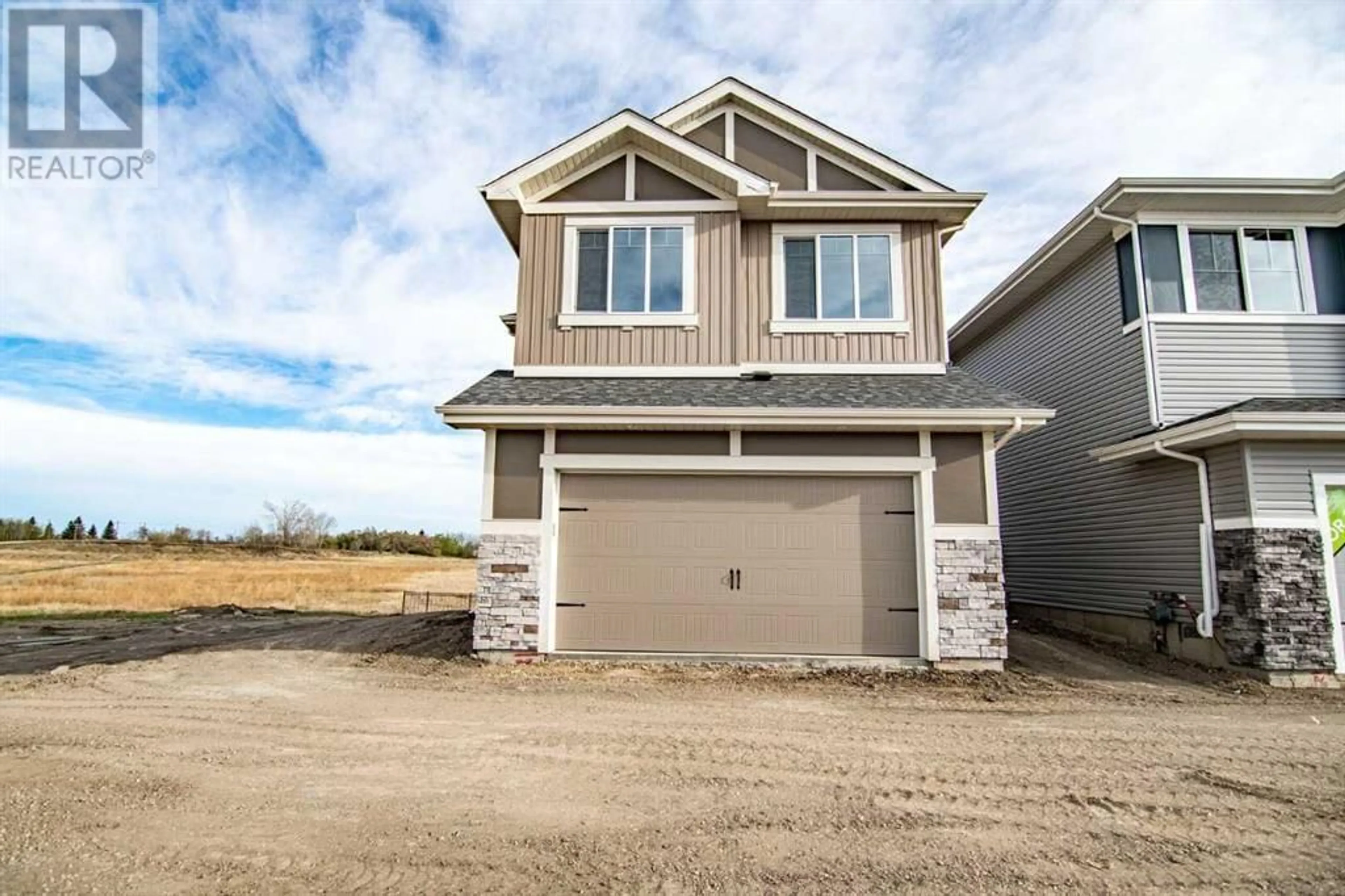 Home with vinyl exterior material, street for 8 LEGACY ROAD, Rural Red Deer County Alberta T4E3C5