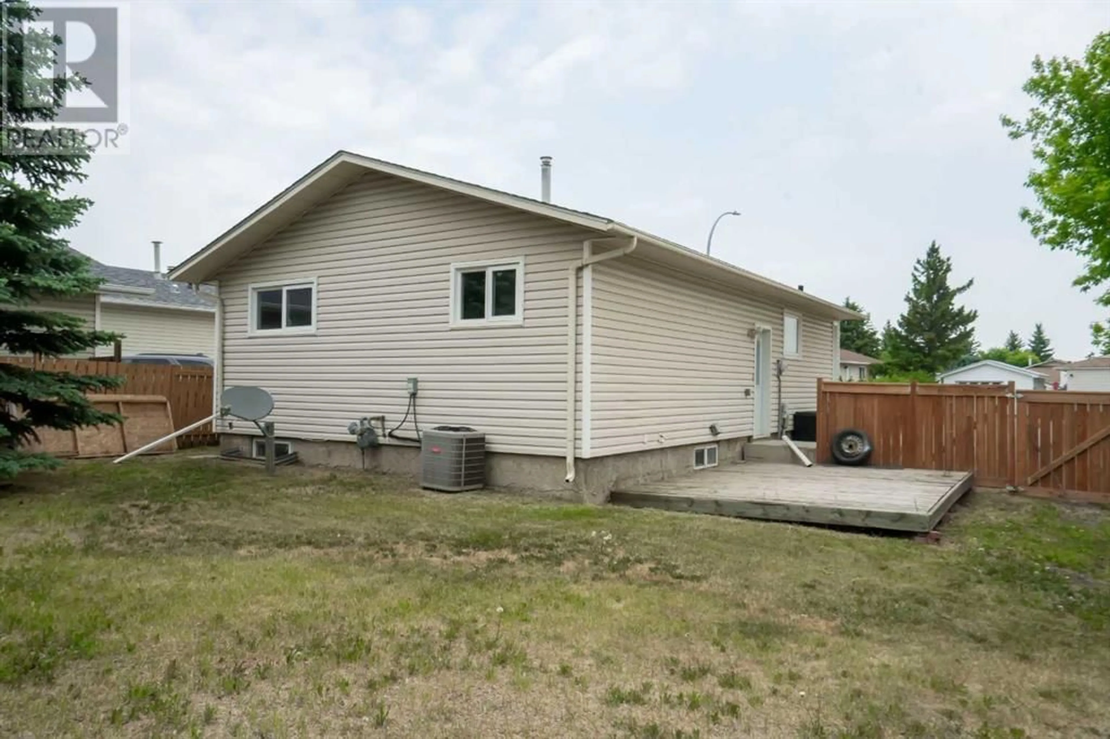 Home with vinyl exterior material, street for 8325 101 AVENUE, Peace River Alberta T8S1N2