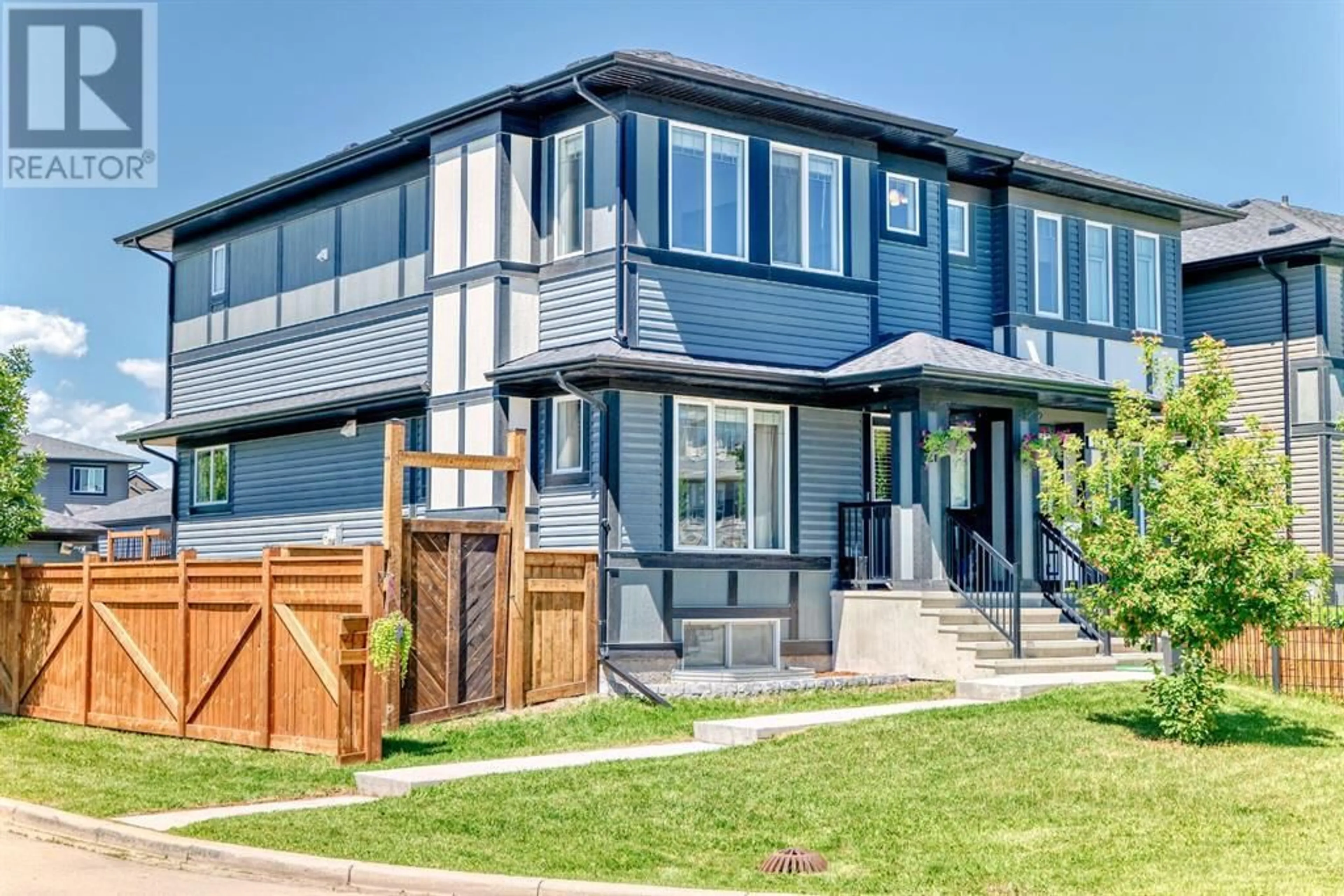 Home with vinyl exterior material, street for 21 BELGIAN LANE, Cochrane Alberta T4C0M3