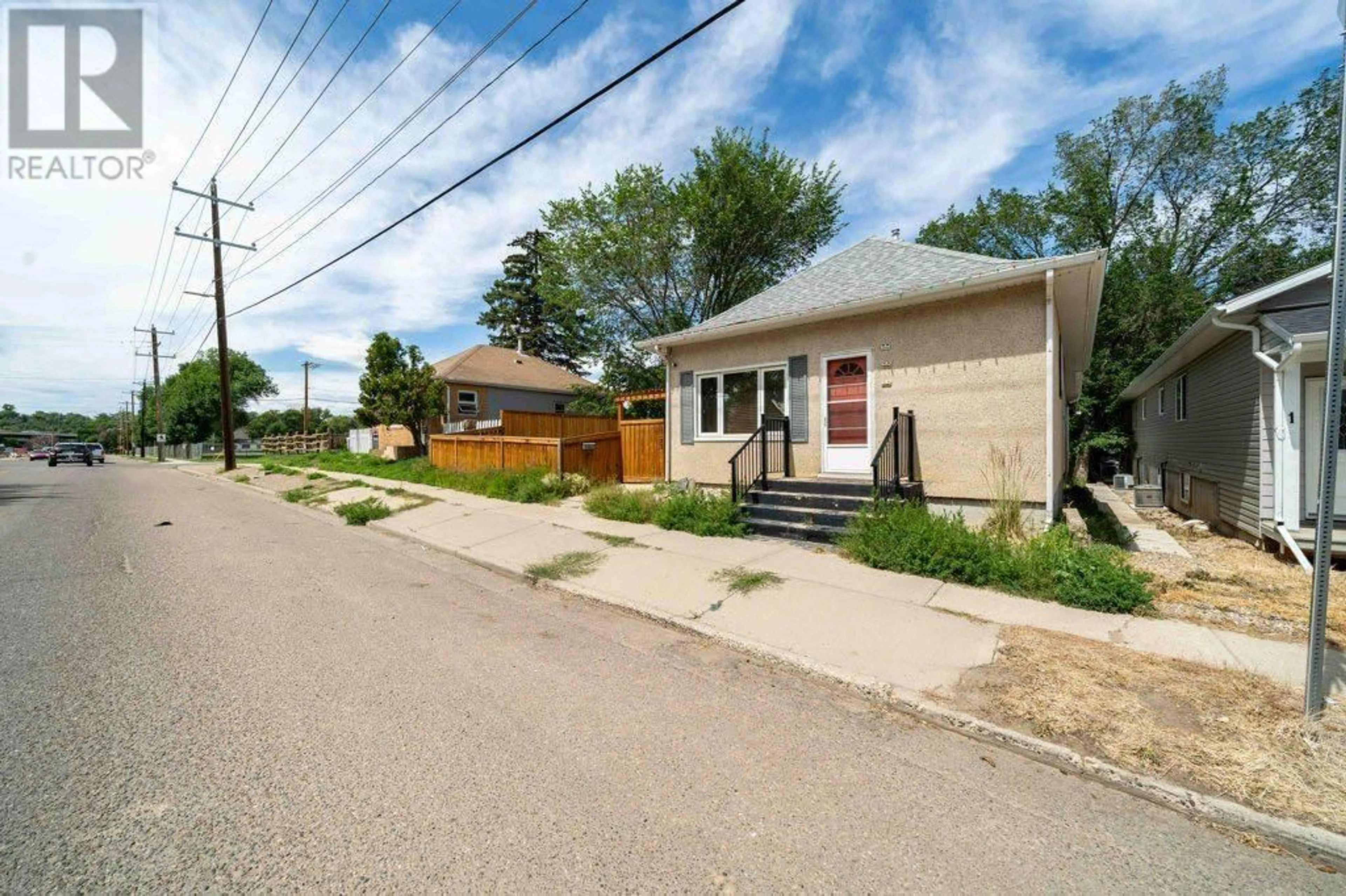 A pic from outside/outdoor area/front of a property/back of a property/a pic from drone, street for 1122 BRIDGE STREET SOUTHEAST, Medicine Hat Alberta T1A1E2