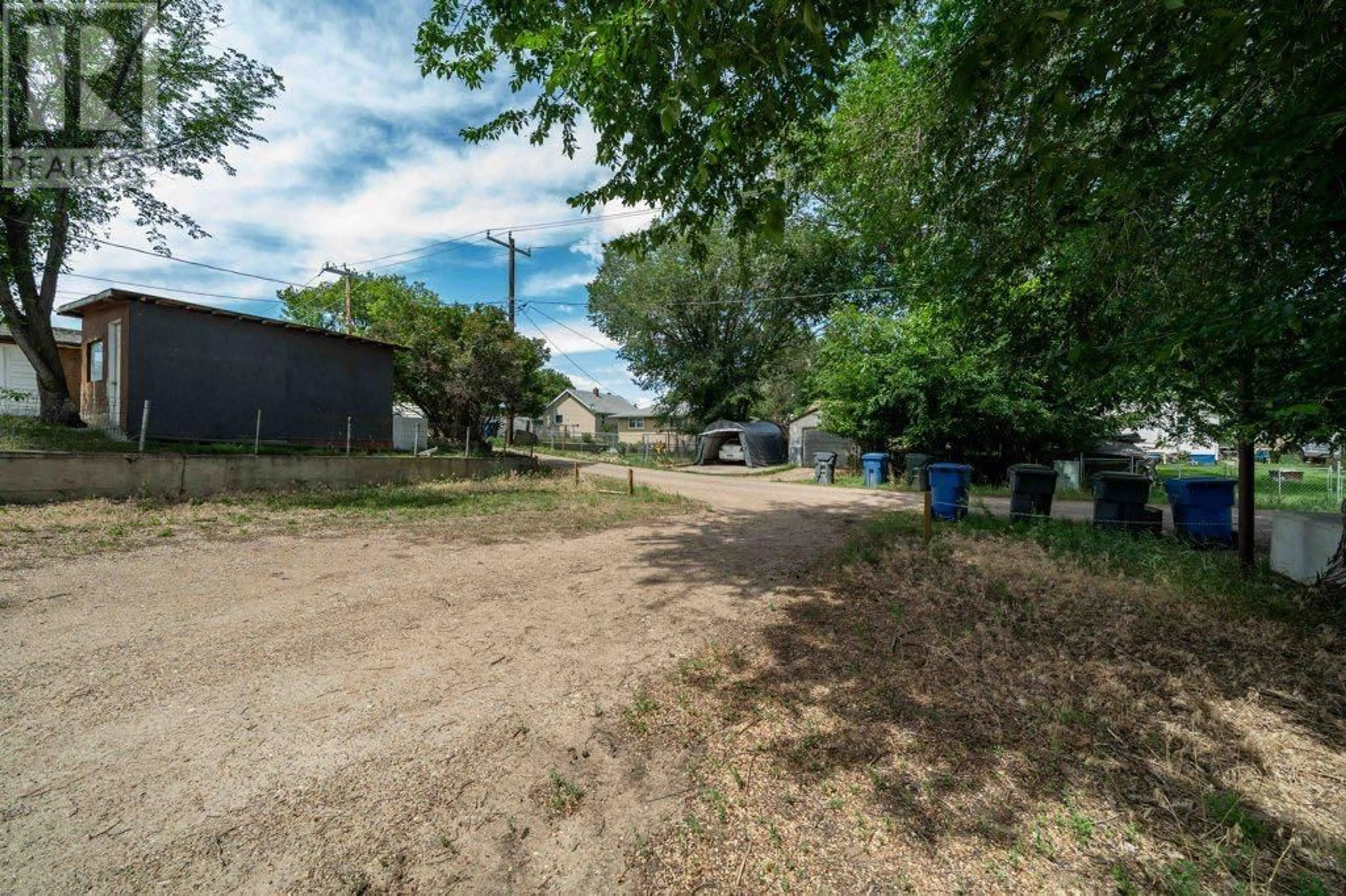 A pic from outside/outdoor area/front of a property/back of a property/a pic from drone, street for 1122 BRIDGE STREET SOUTHEAST, Medicine Hat Alberta T1A1E2