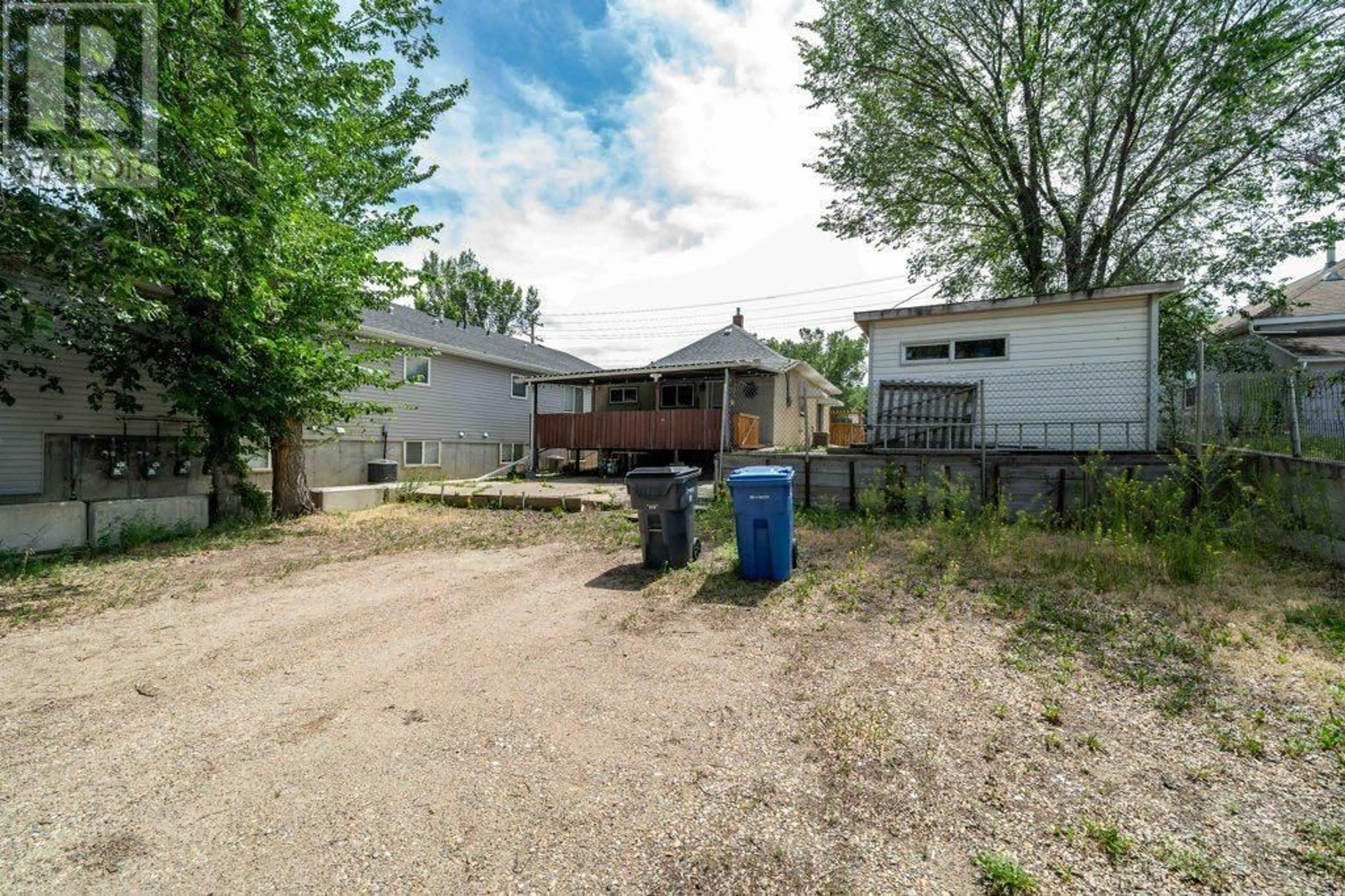 A pic from outside/outdoor area/front of a property/back of a property/a pic from drone, street for 1122 BRIDGE STREET SOUTHEAST, Medicine Hat Alberta T1A1E2