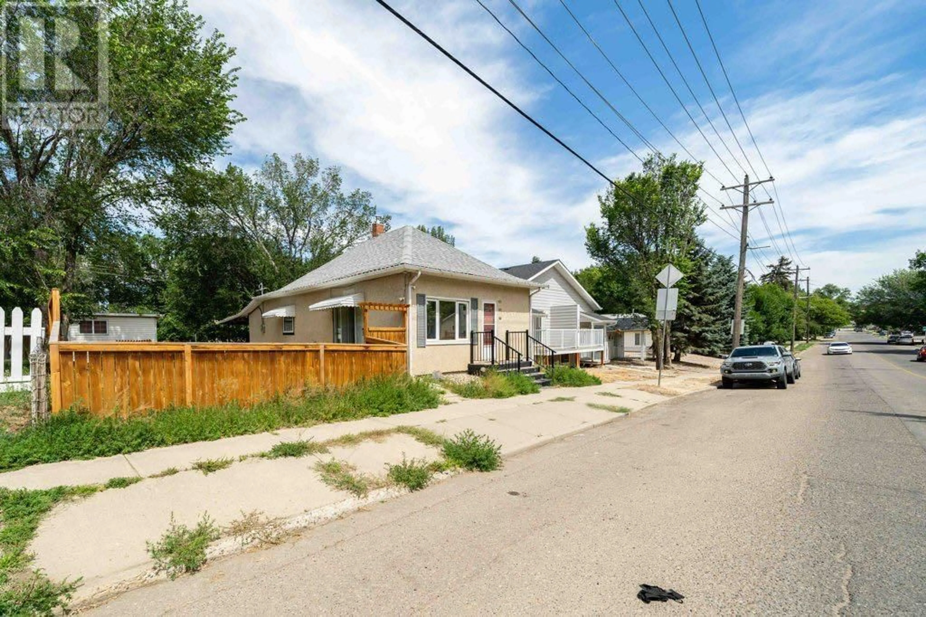 A pic from outside/outdoor area/front of a property/back of a property/a pic from drone, street for 1122 BRIDGE STREET SOUTHEAST, Medicine Hat Alberta T1A1E2