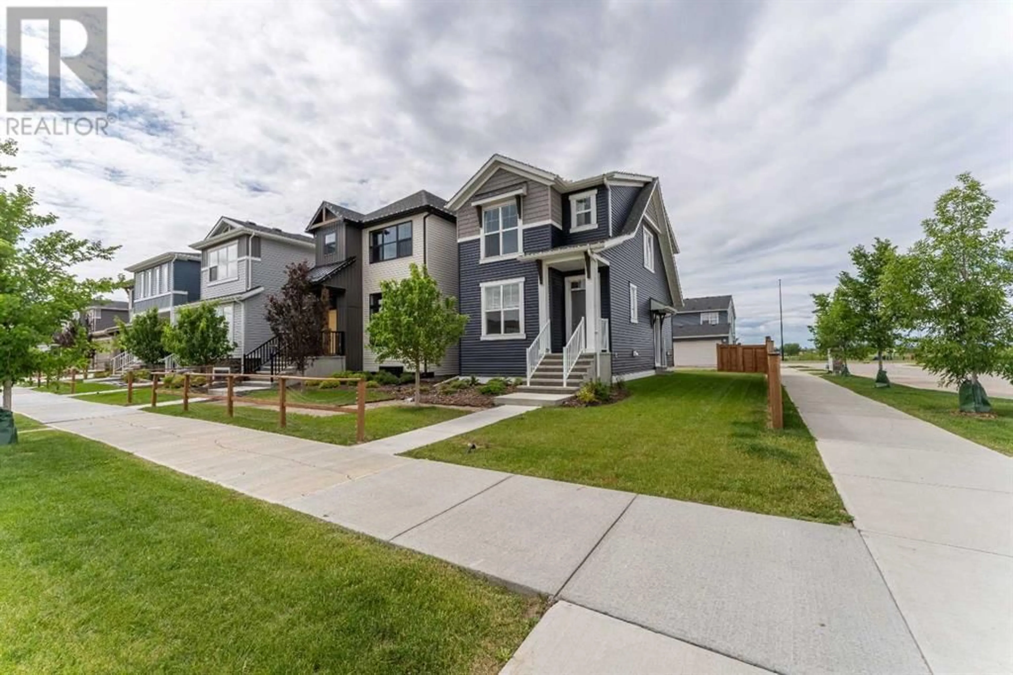 A pic from outside/outdoor area/front of a property/back of a property/a pic from drone, street for 121 HOTCHKISS WAY SOUTHEAST, Calgary Alberta T3S0G3