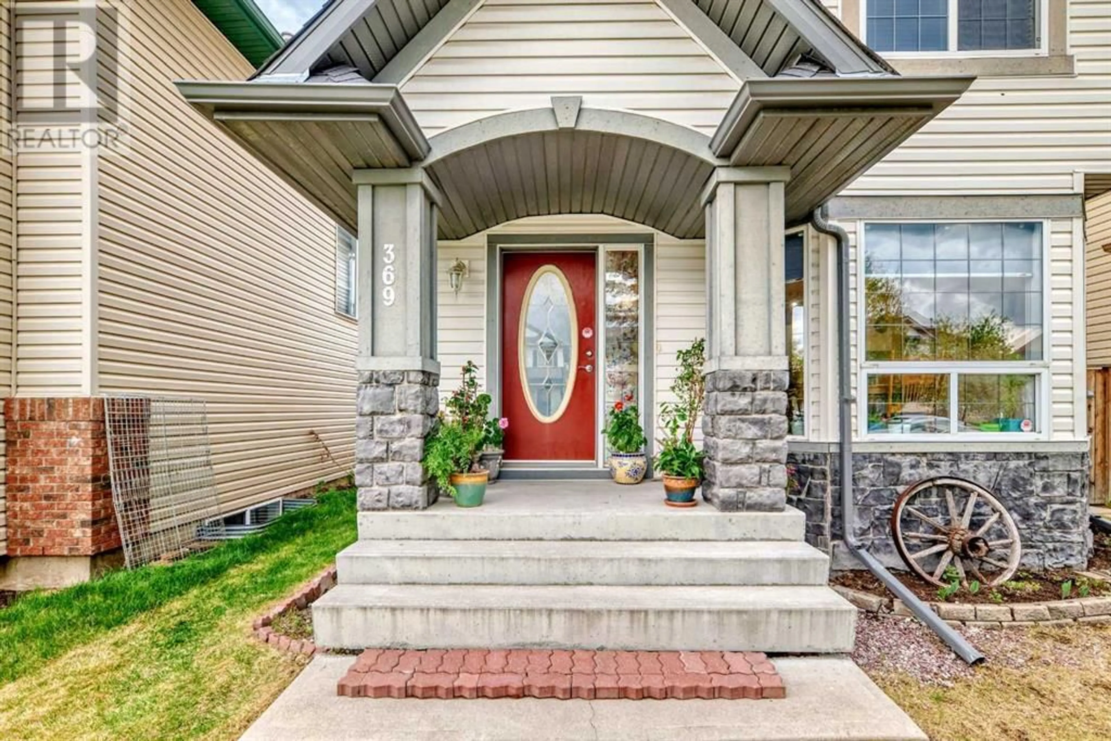 Home with brick exterior material, street for 369 TARADALE DRIVE NORTHEAST, Calgary Alberta T3J4S2