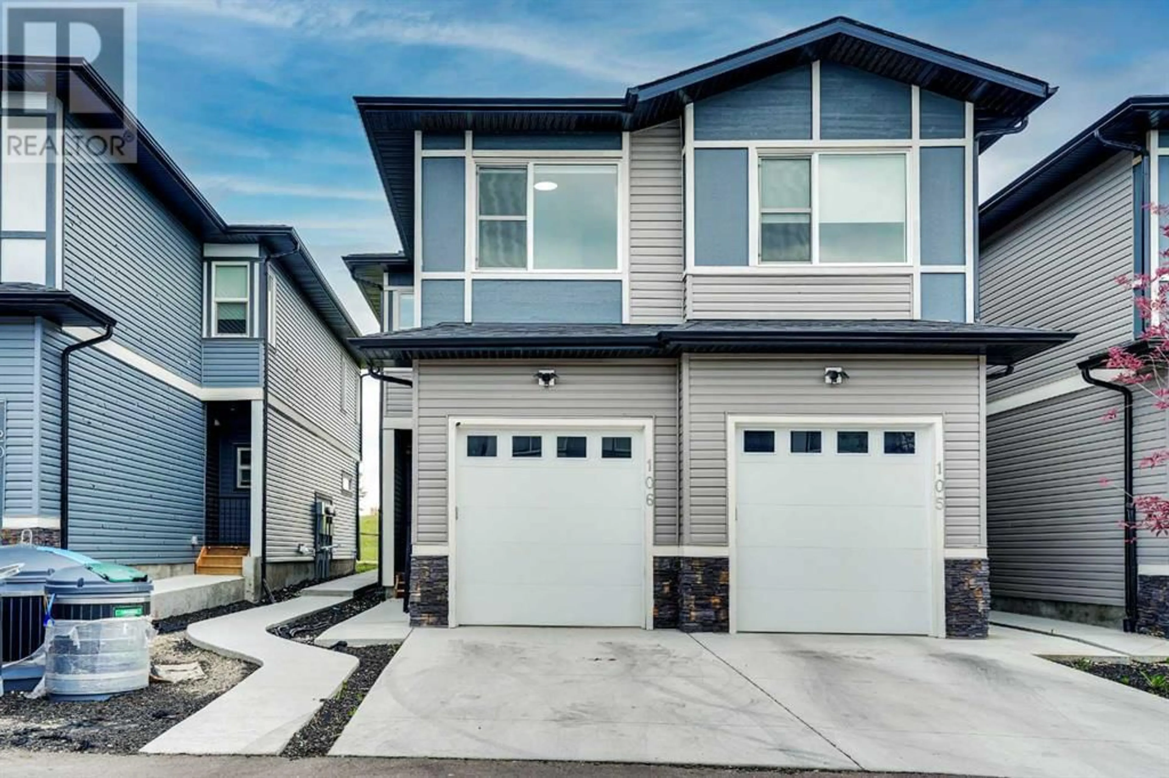 Home with vinyl exterior material, street for 116 SADDLESTONE HEATH NORTHEAST, Calgary Alberta T3J5K8