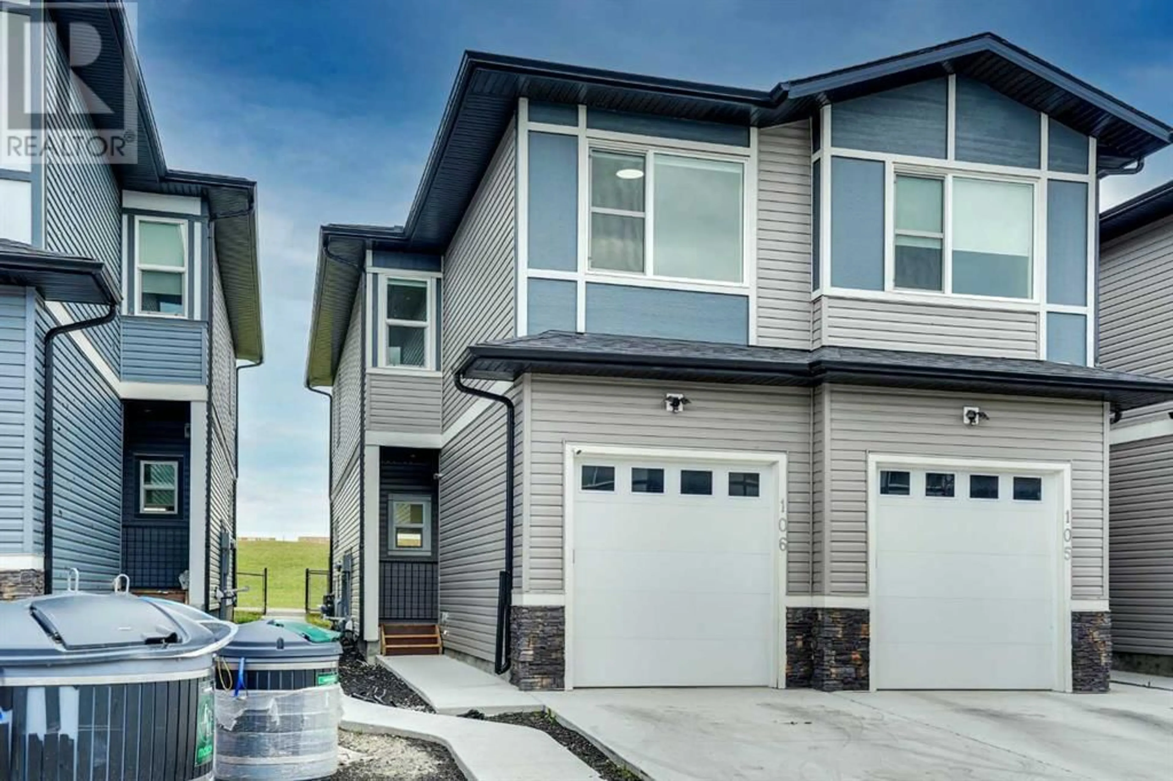 Home with vinyl exterior material, street for 116 SADDLESTONE HEATH NORTHEAST, Calgary Alberta T3J5K8
