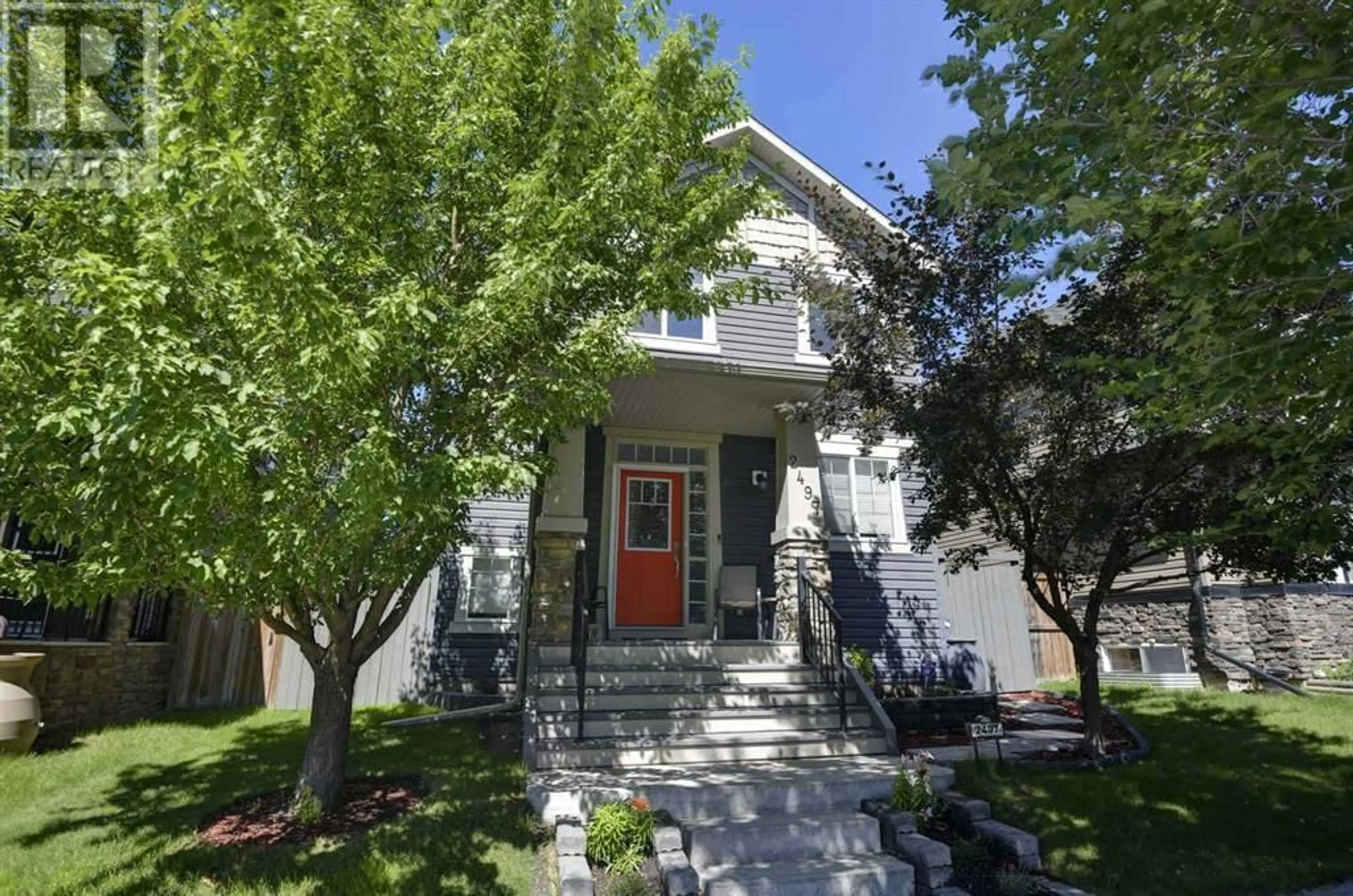 Home with vinyl exterior material, street for 2497 RAVENSWOOD VIEW SOUTHEAST, Airdrie Alberta T4A0K1